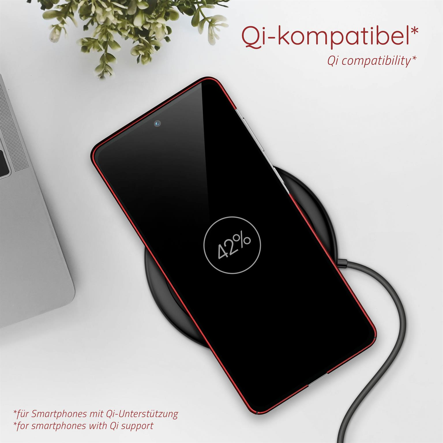 Schwarzes Telefon auf kabellosem Ladegerät, roter Umriss, weißer Hintergrund.