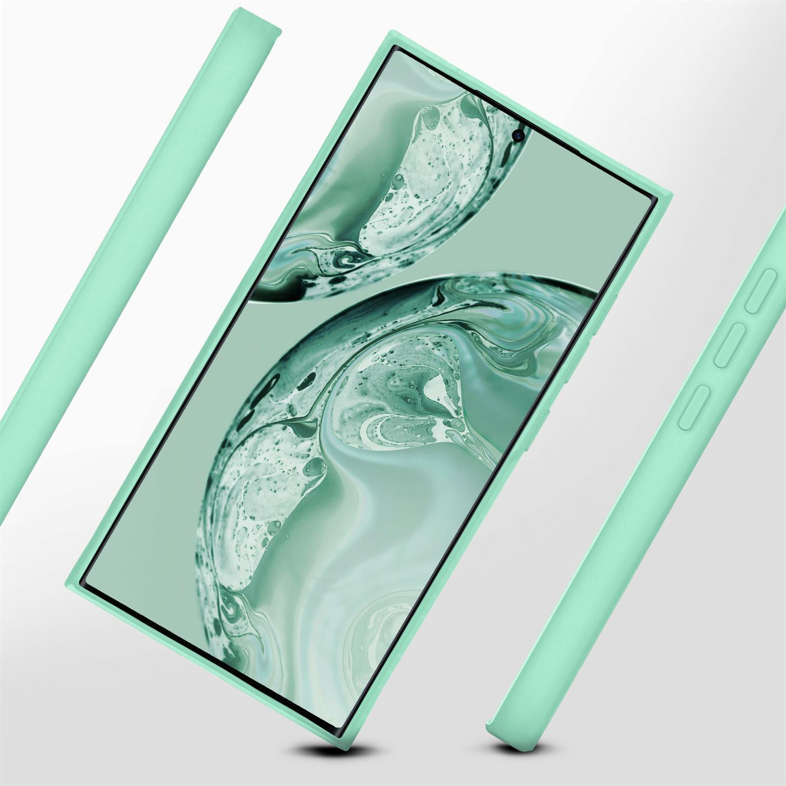 Telefon mit mintgrüner Hülle, umgeben von Gehäuseteilen, auf weißem Grund.