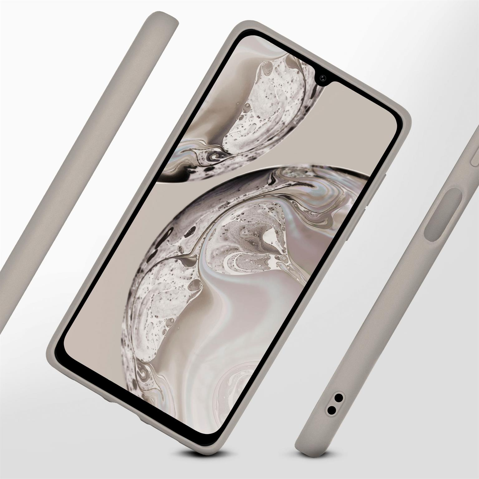 Ein graues Telefon in einer grauen Hülle. Drei graue Teile drumherum. Der Hintergrund ist hellgrau.