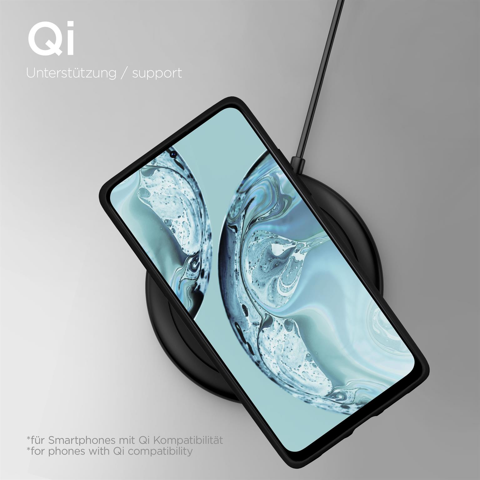 Telefon auf kabellosem Ladegerät. Schwarze Handyhülle. Text: Qi Unterstützung/support.
