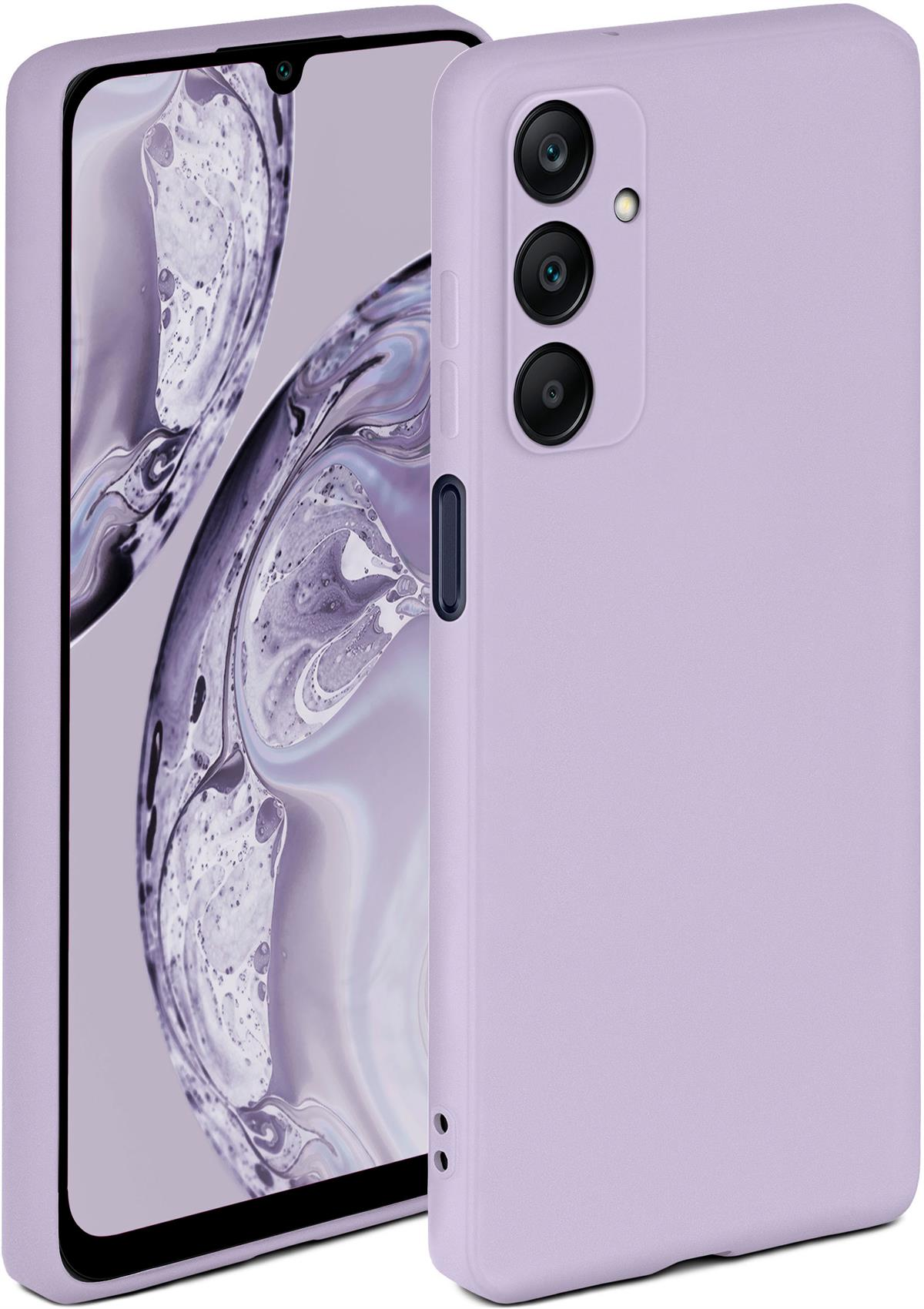 Lila Handyhülle. Ein Telefon ist darin. Die Hülle hat eine matte Oberfläche. Hintergrund ist unscharf.