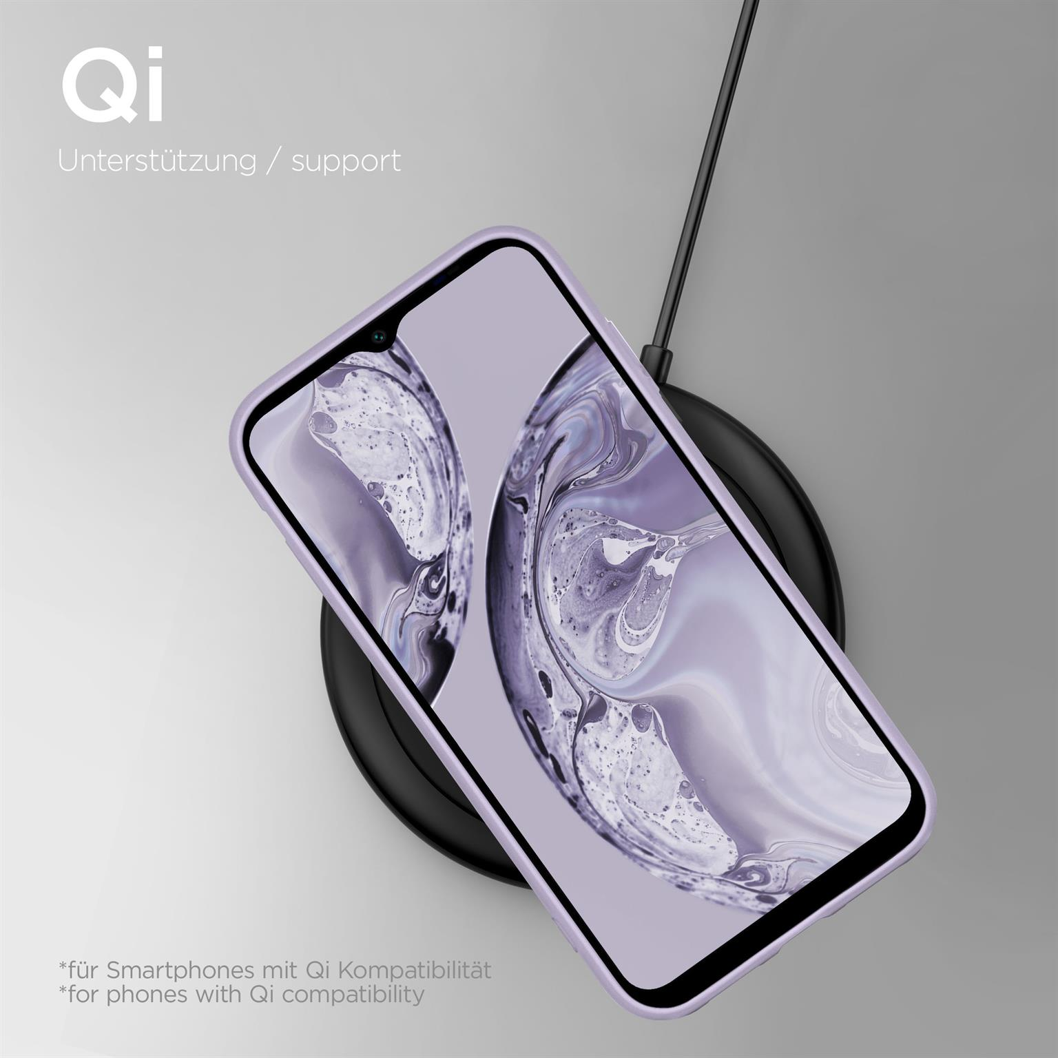 Lila Telefon in einer Hülle, kabelloses Laden auf schwarzer Scheibe. Text: QI-Unterstützung für Smartphones.