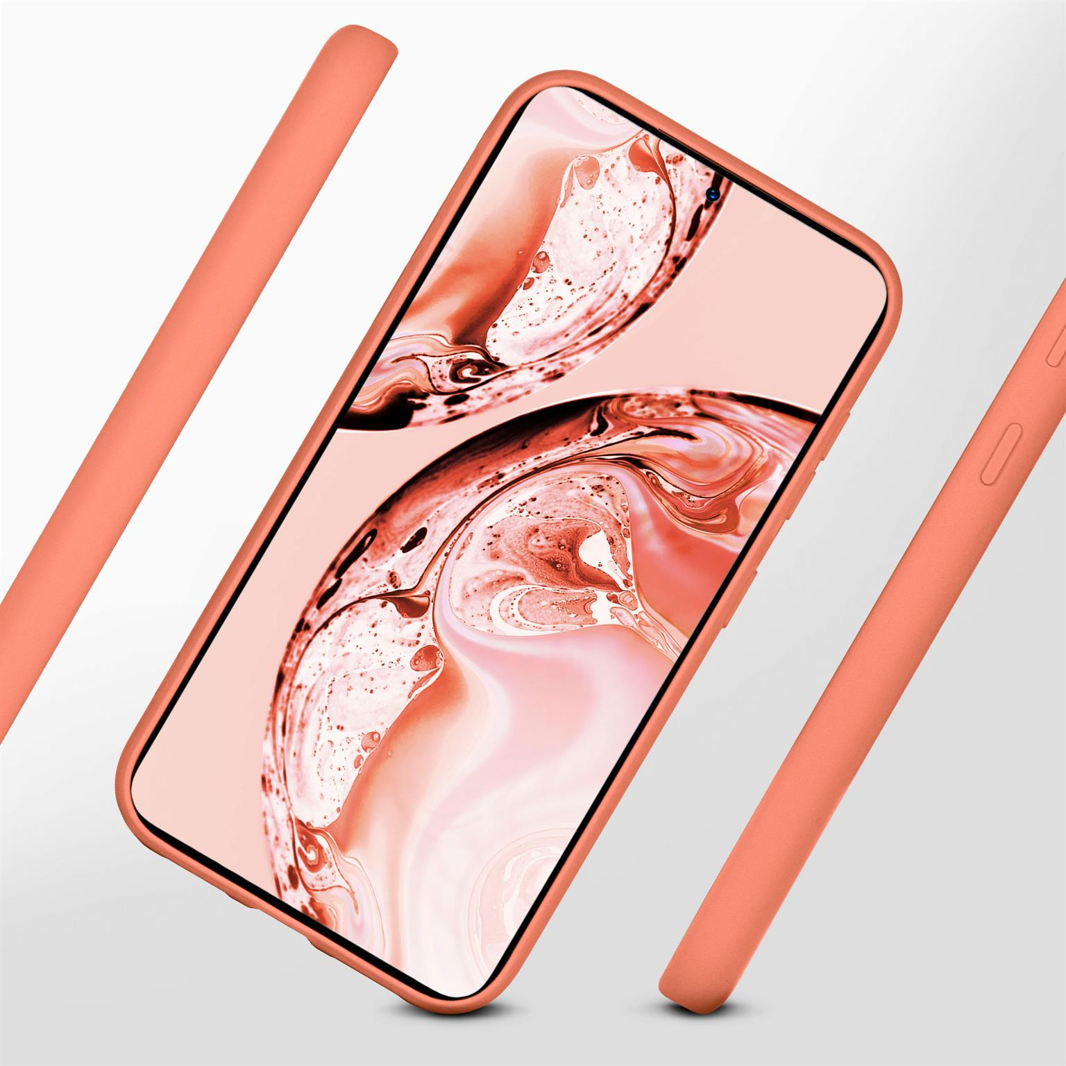 Ein korallenfarbenes Telefon in einer Hülle, abgewinkelt mit drei Gehäuseteilen. Der Bildschirm zeigt einen rötlichen Hintergrund.