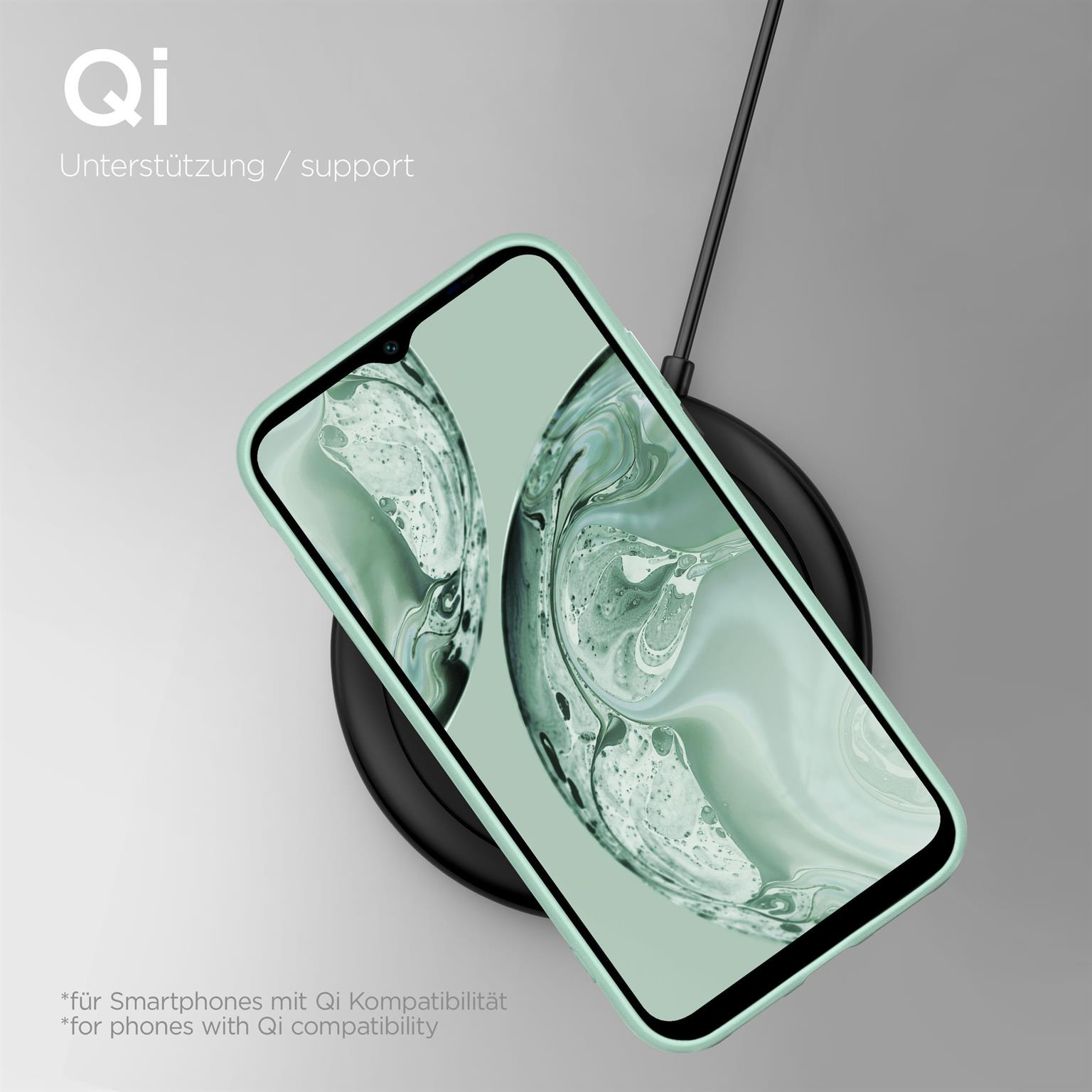 Grüne Handyhülle auf kabellosem Ladegerät. Text: Qi-Unterstützung. Schwarzes Ladepad.