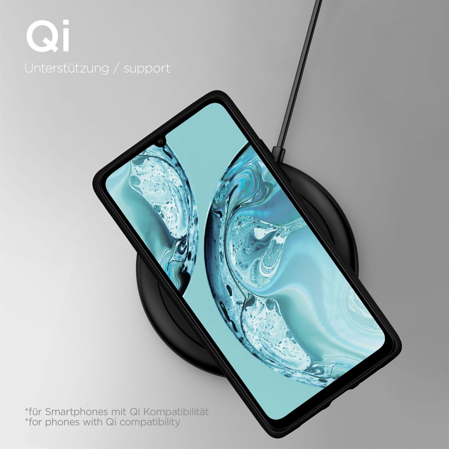 Ein schwarzes Telefon auf einem kabellosen Ladegerät, mit hellblauem Hintergrund.