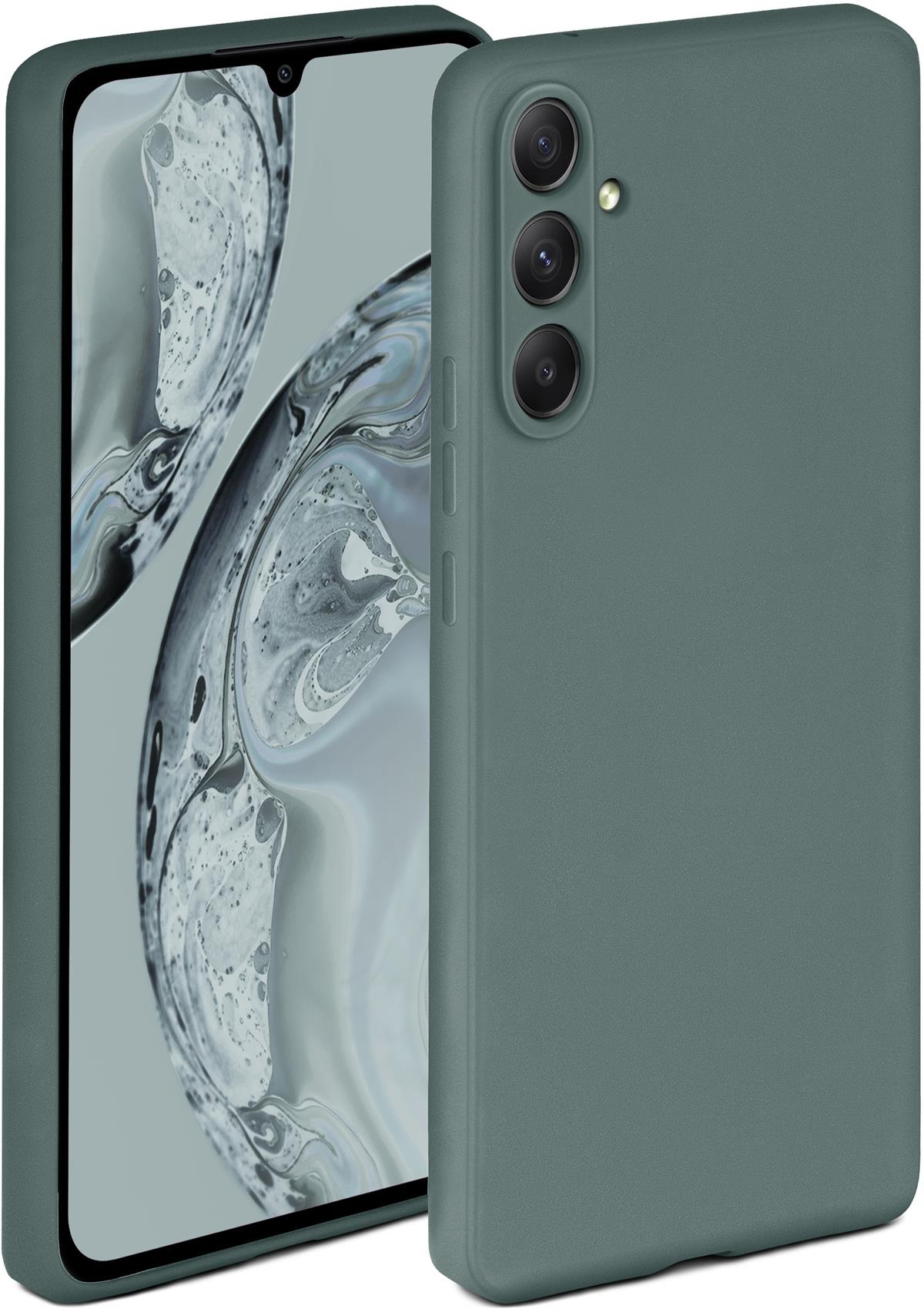 Eine grüne Handyhülle mit einem Telefon darin. Der Hintergrund ist ein abstraktes Design.
