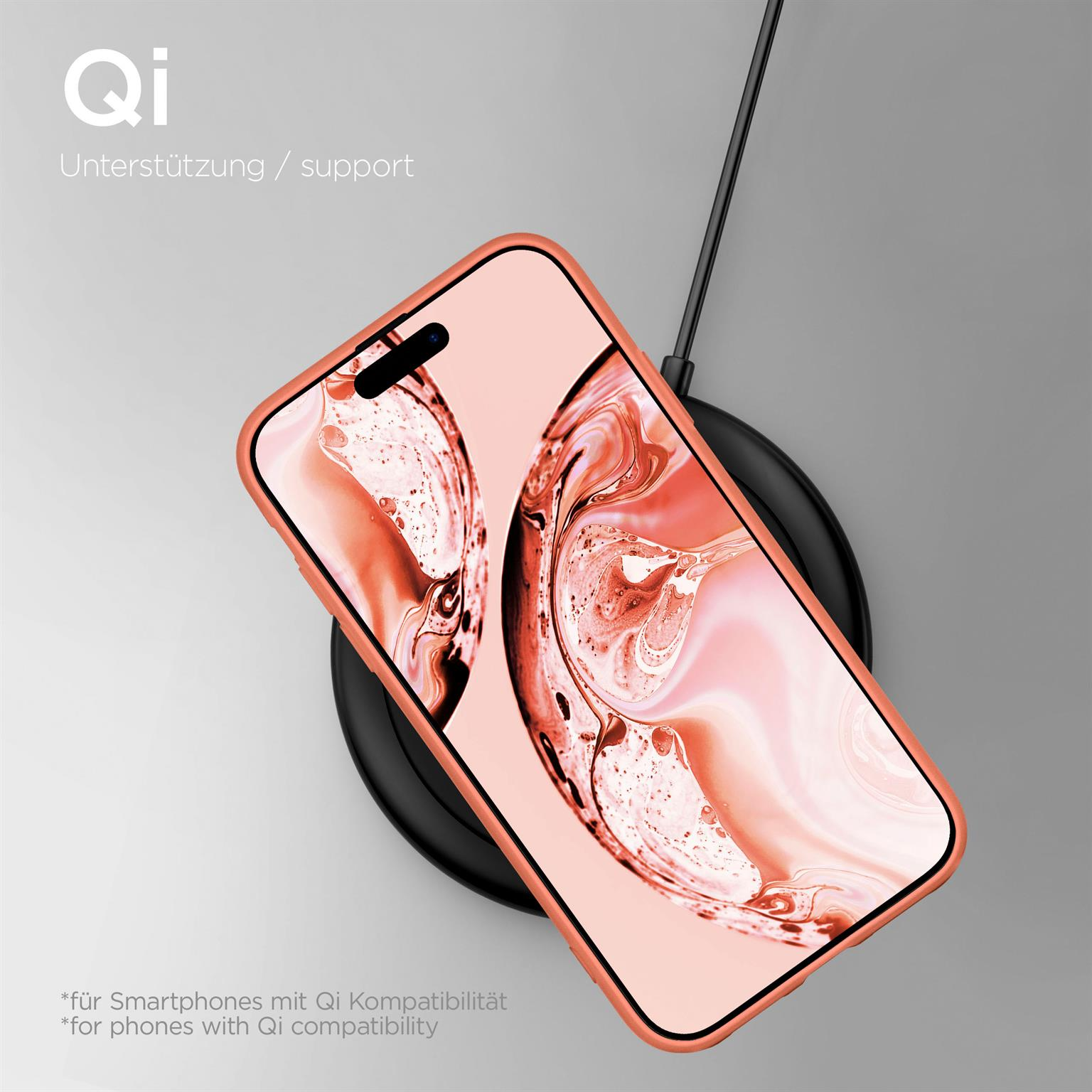 Ein Telefon auf einem kabellosen Ladegerät. Das Telefon befindet sich in einer pfirsichfarbenen Hülle.
