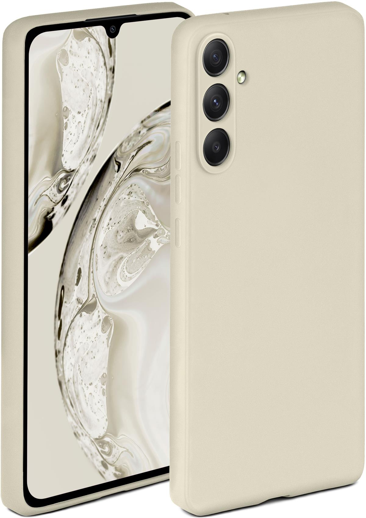 Beige Handyhülle neben einem Handy. Der Hintergrund ist ein verschwommenes Bild.