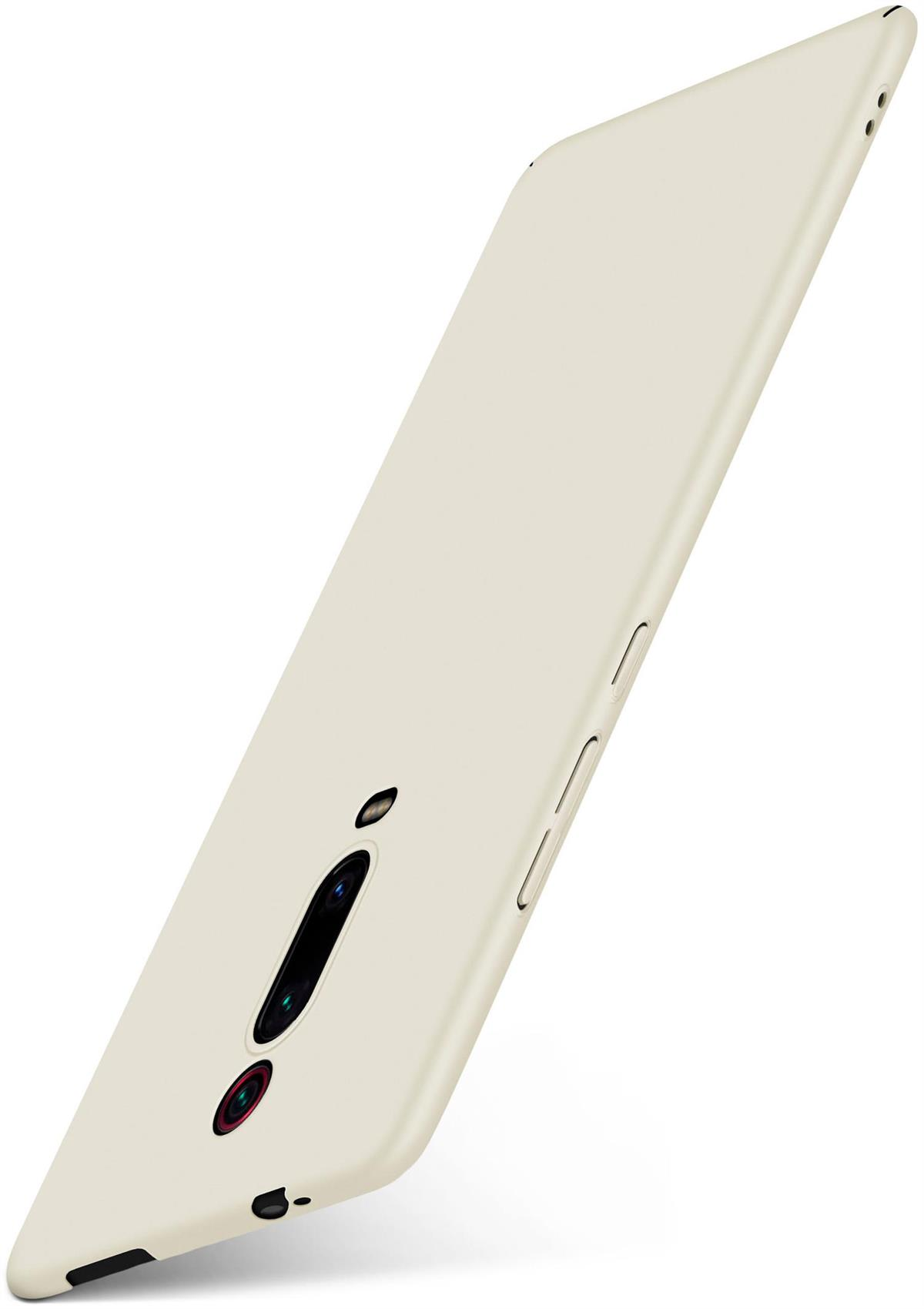 Ein cremefarbenes Telefon mit Hülle wird gezeigt.