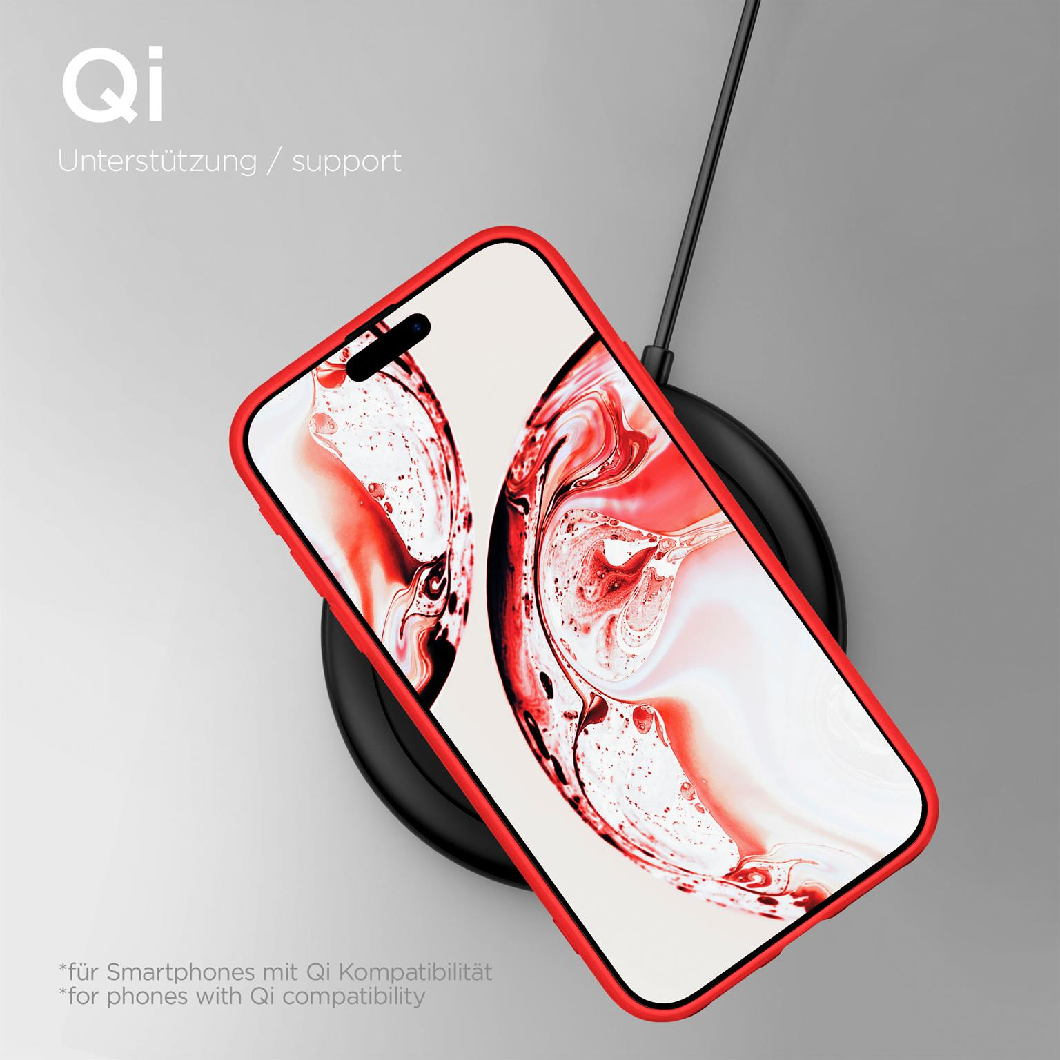 Ein Telefon in einer roten Hülle lädt auf einem schwarzen kabellosen Ladegerät.