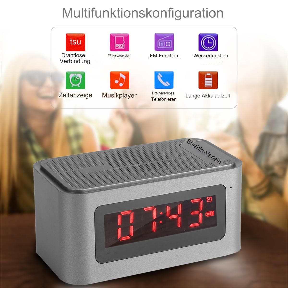 Grauer Wecker mit Anzeige 07:43. Icons zeigen drahtlos, TF-Karte, FM, Alarm und Akku.