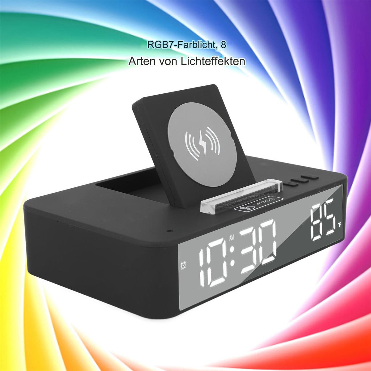 Schwarzer Wecker mit kabellosem Ladegerät, Anzeige von Zeit und Temperatur.