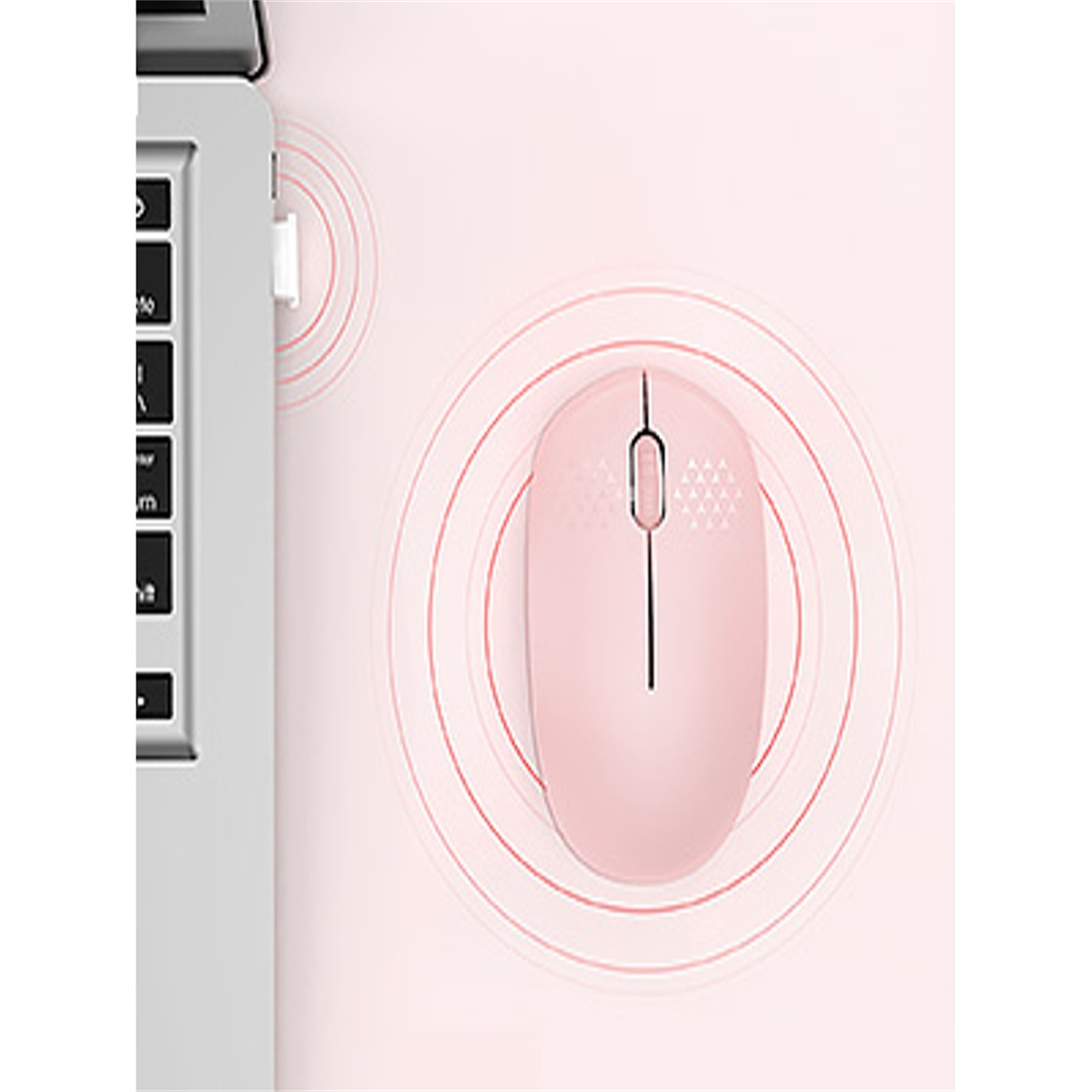Eine pinke kabellose Maus neben einem Laptop mit USB-Empfänger.