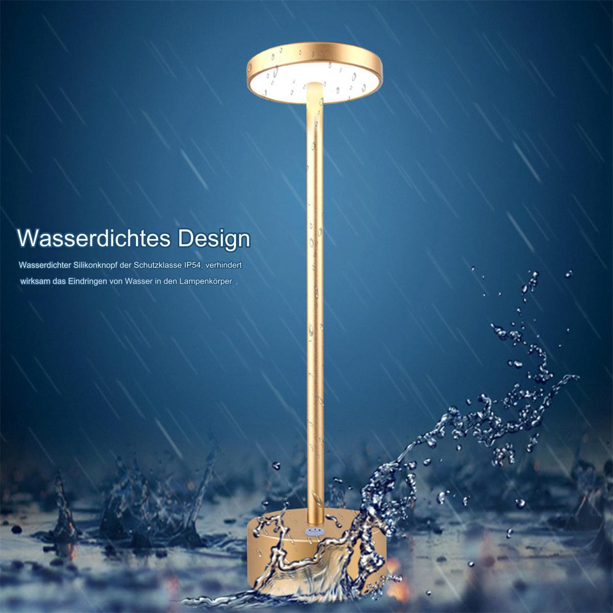 Goldfarbene Lampe mit Wasserspritzeffekt im Hintergrund.