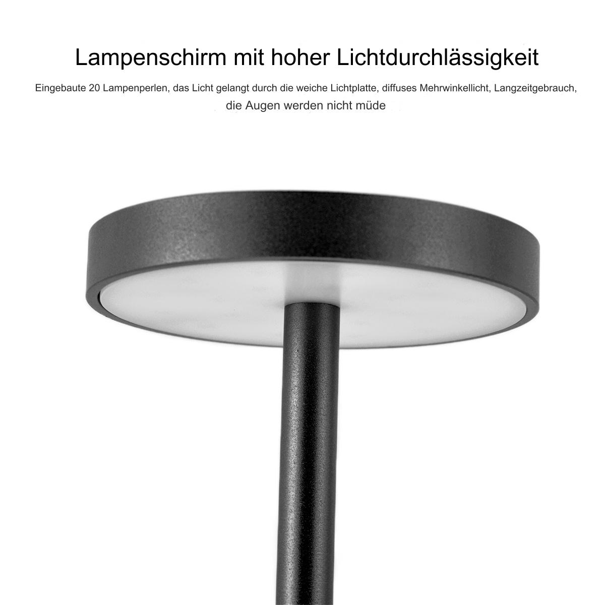 Schwarze Lampe mit rundem Licht und schwarzem Ständer auf weißem Hintergrund.