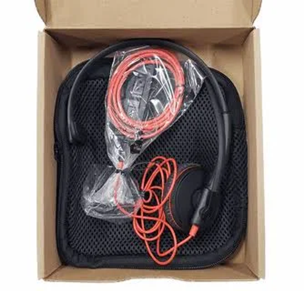 Headphones in a case. Black case, with a red cord and headphones. Inside a cardboard box.