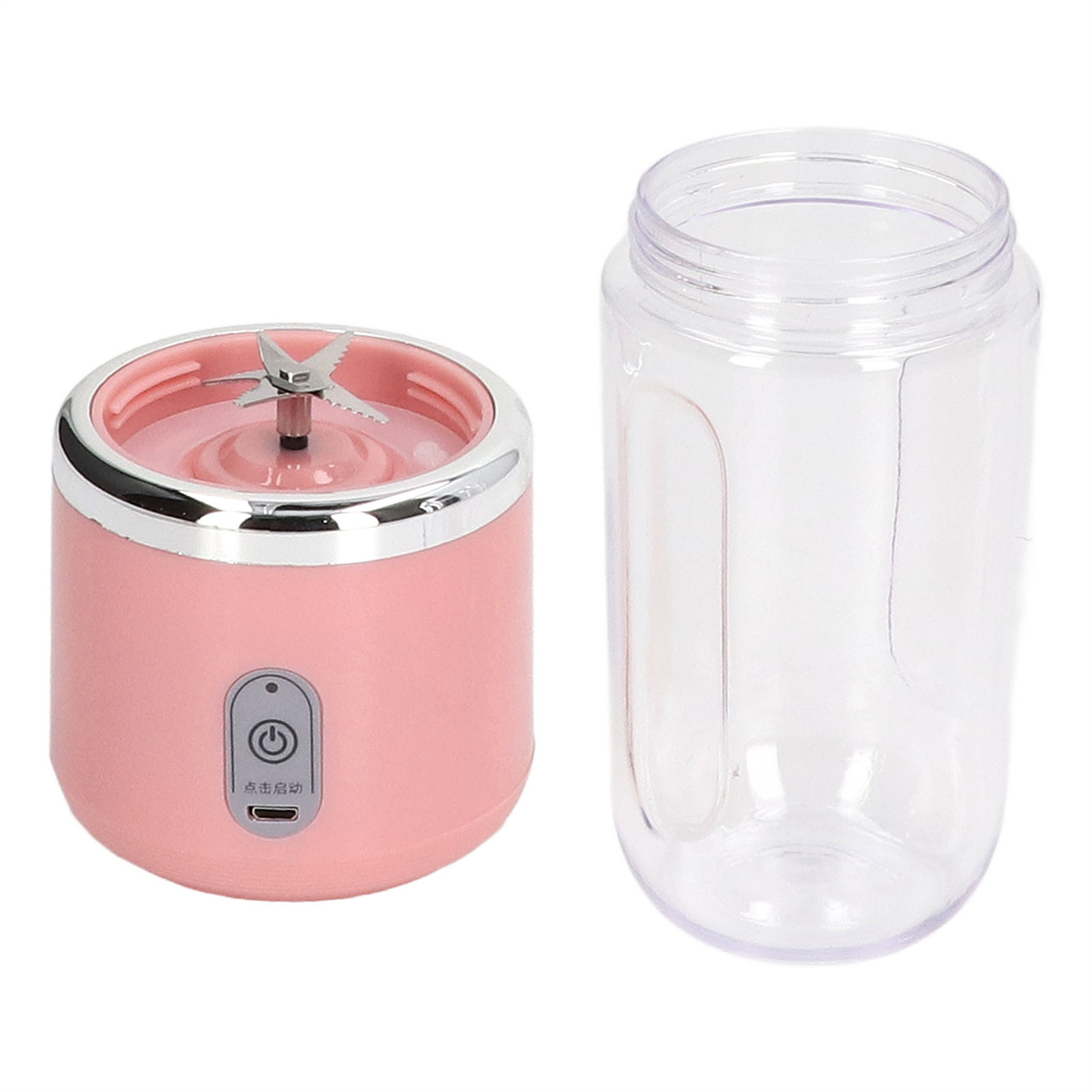 Ein rosa tragbarer Mixer mit einem durchsichtigen Glas rechts davon.