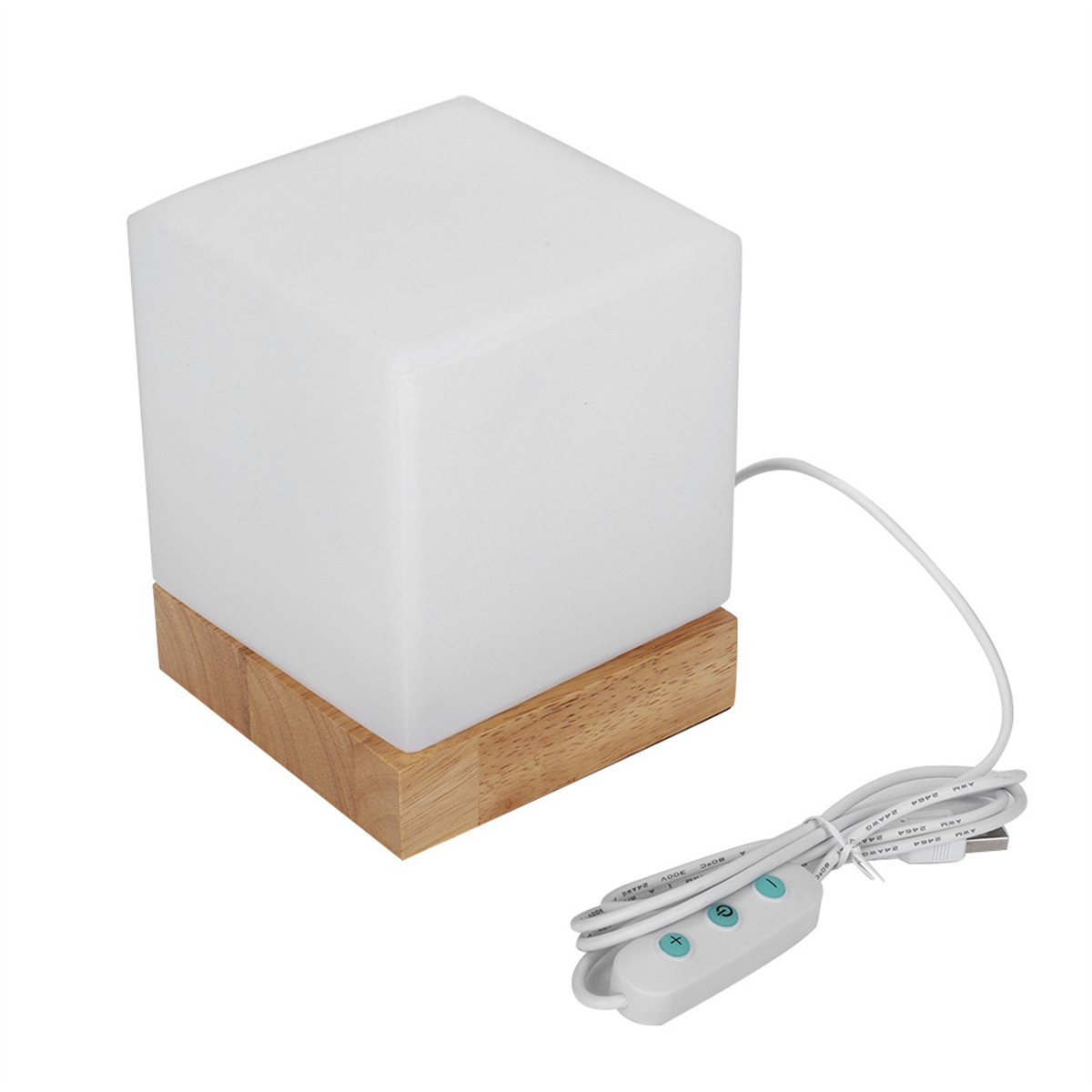 Eine weiße würfelförmige Lampe auf einem Holzsockel. Die Lampe hat einen Dimmschalter und ein USB-Kabel.