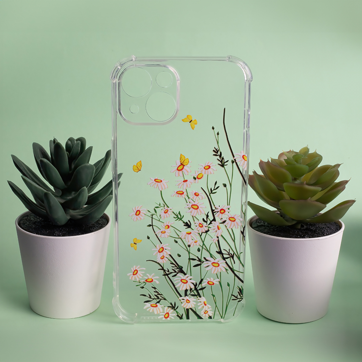 Transparente Handyhülle mit Blumendesign und zwei kleinen Topfpflanzen.