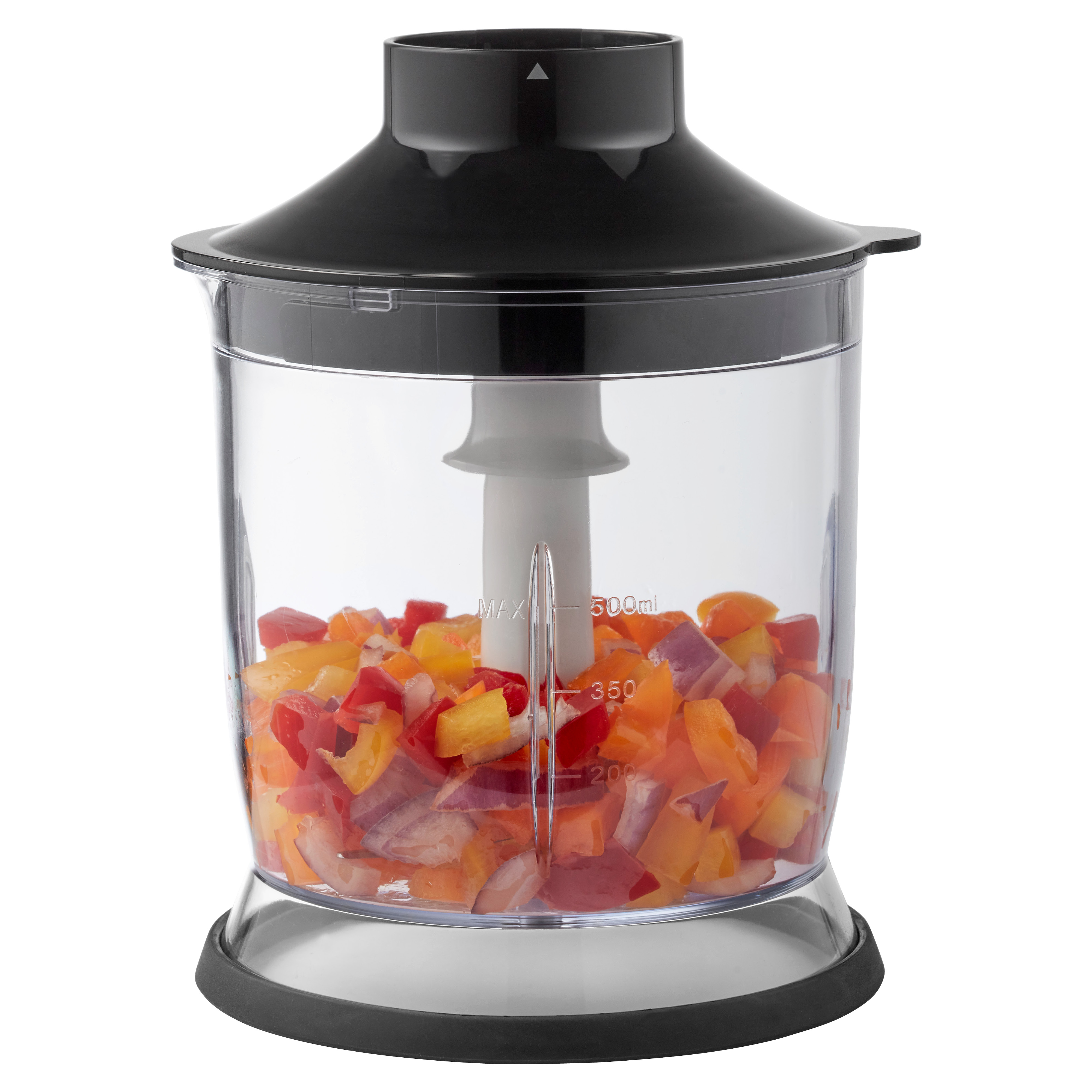 A blender with chopped vegetables inside. The blender is clear with a black top.