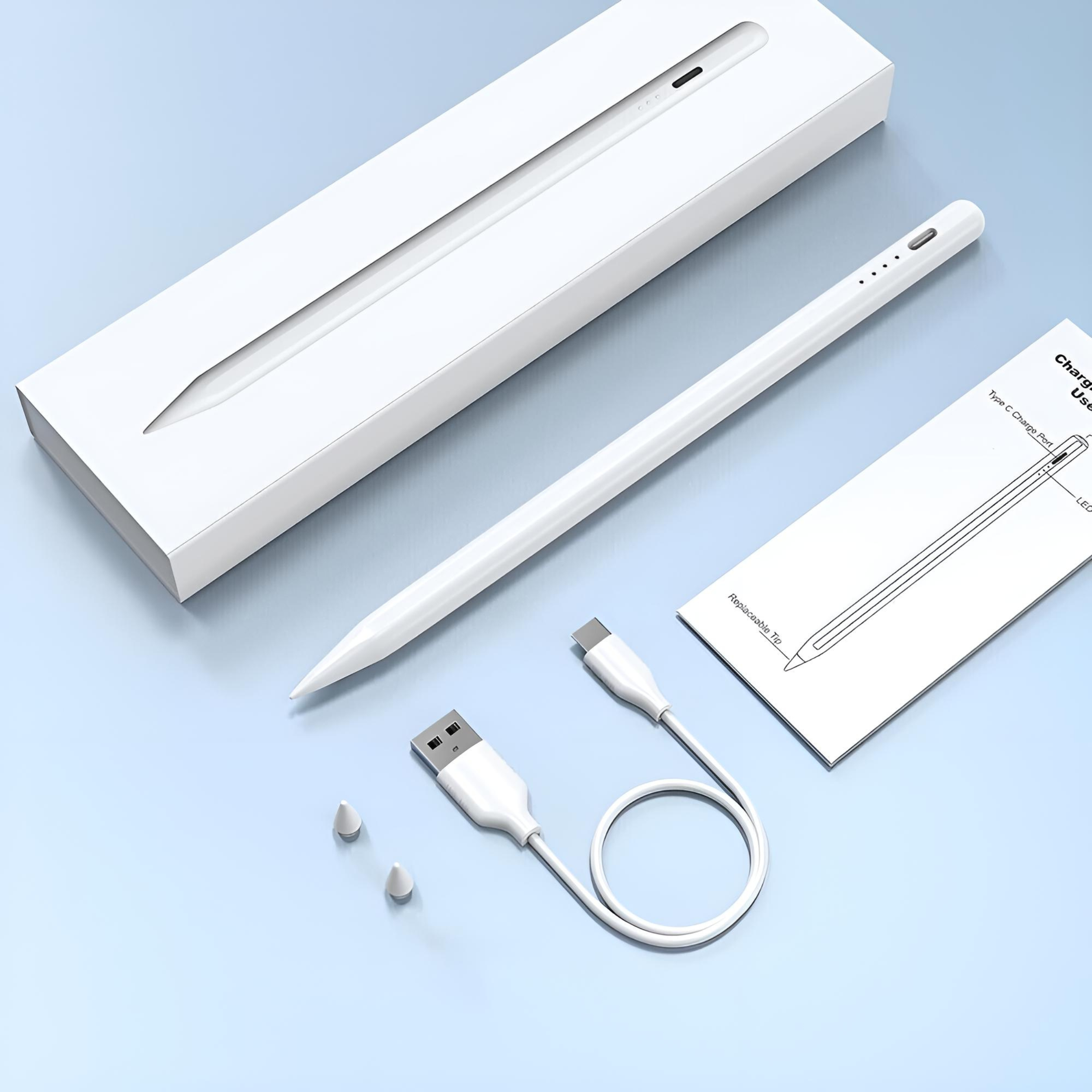 Weißer Stift mit Box, Ladegerät und Ersatzspitzen auf blauem Untergrund, mit Anleitung.