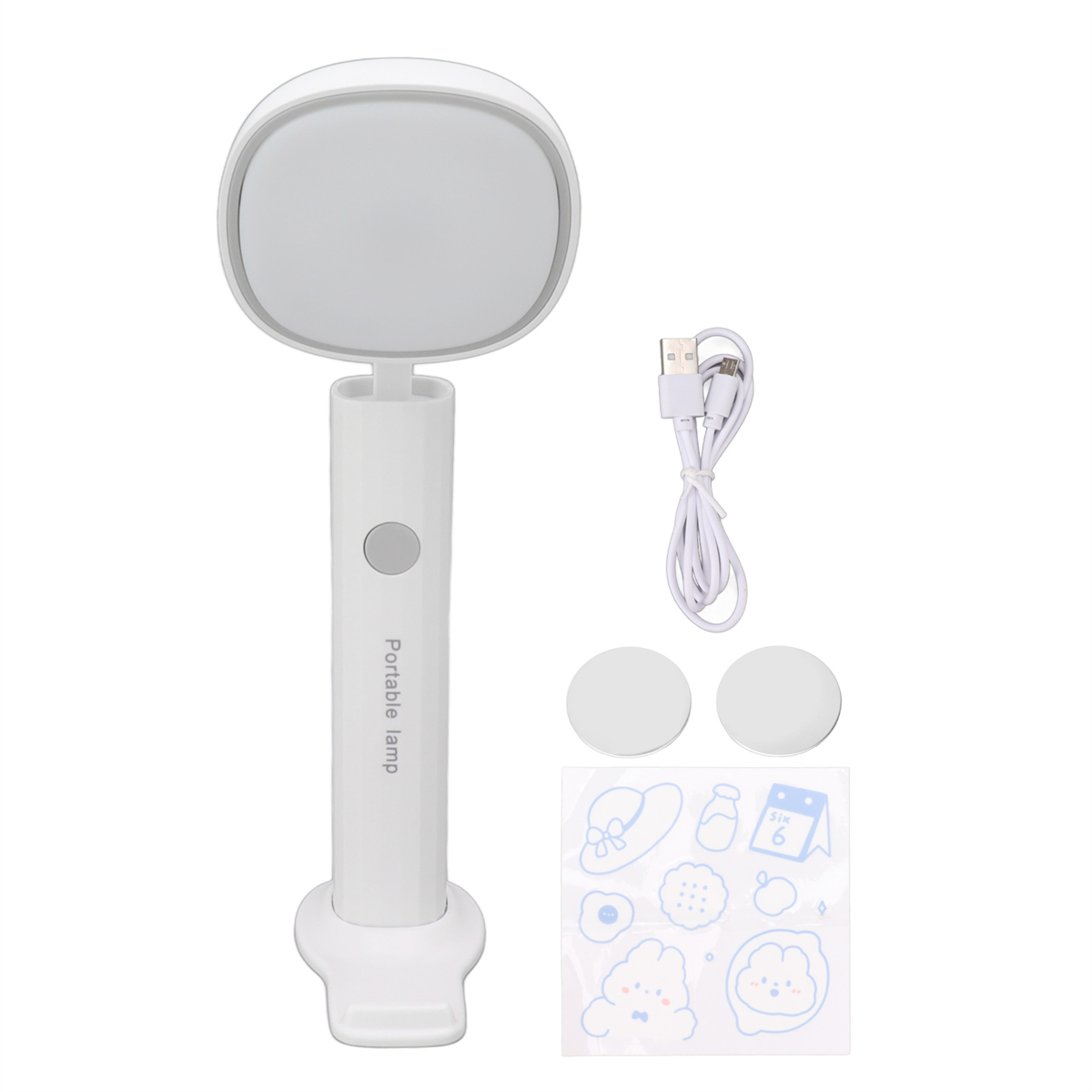 Weiße tragbare Lampe mit Griff, rundem Licht, Aufklebern und USB-Kabel.