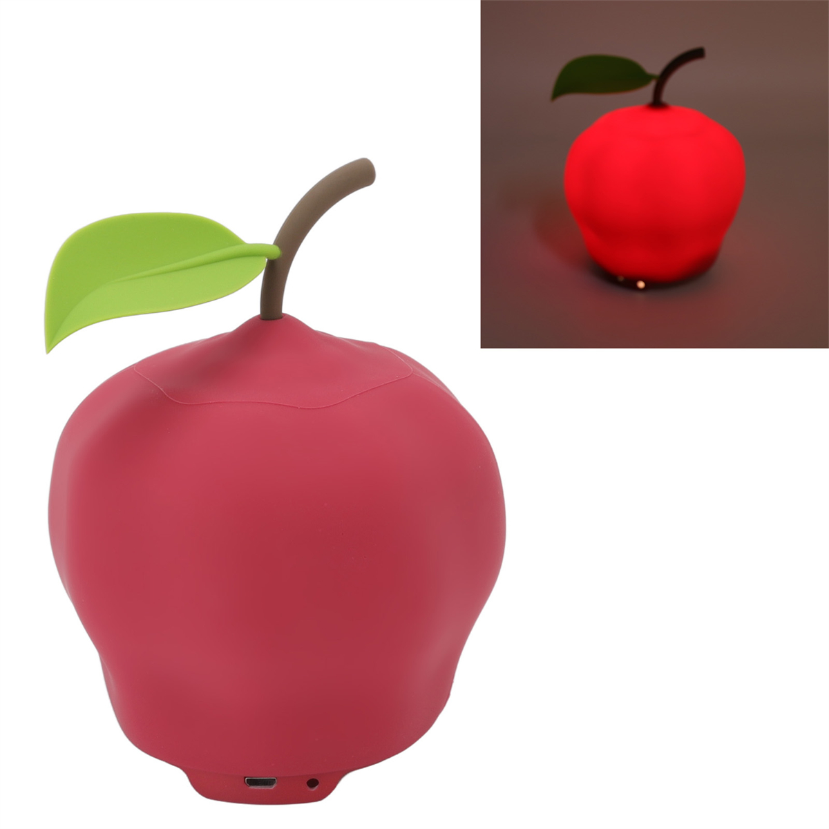 Eine rote apfelförmige Lampe mit grünem Blatt und einem separaten leuchtenden Apfel, rotes Leuchten.