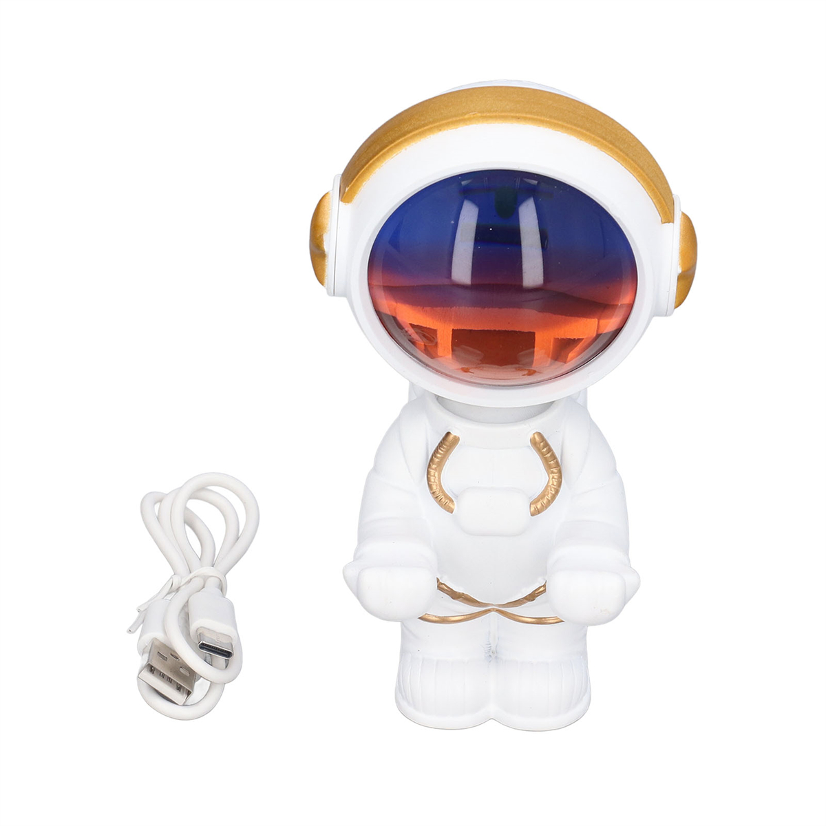 Ein weißer, astronautenförmiger Projektor mit einer Sonnenuntergangsszene und einem USB-Kabel daneben.