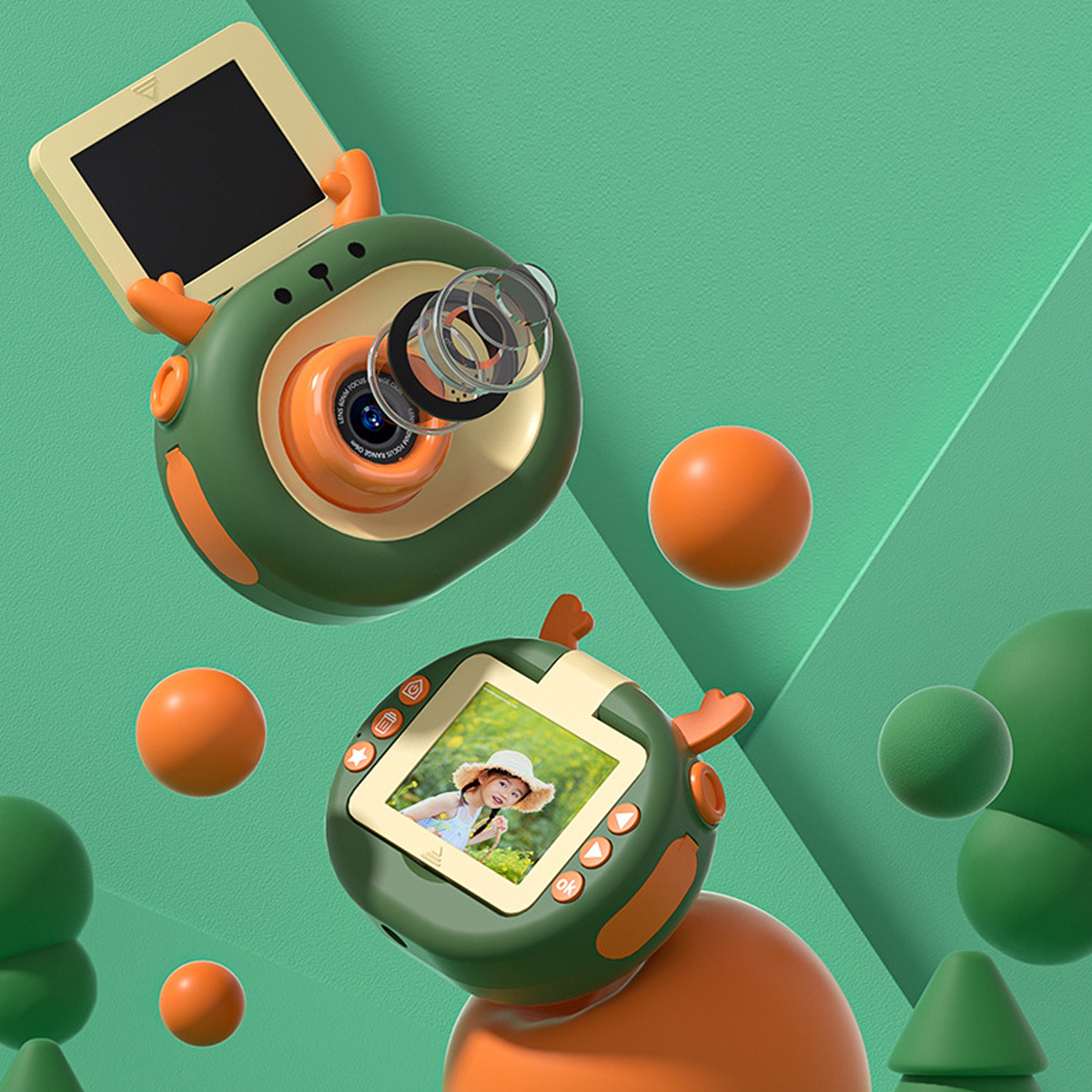 Zielony i pomarańczowy aparat z dwoma ekranami i trzema pomarańczowymi kulkami.  Obrazek z kreskówki.