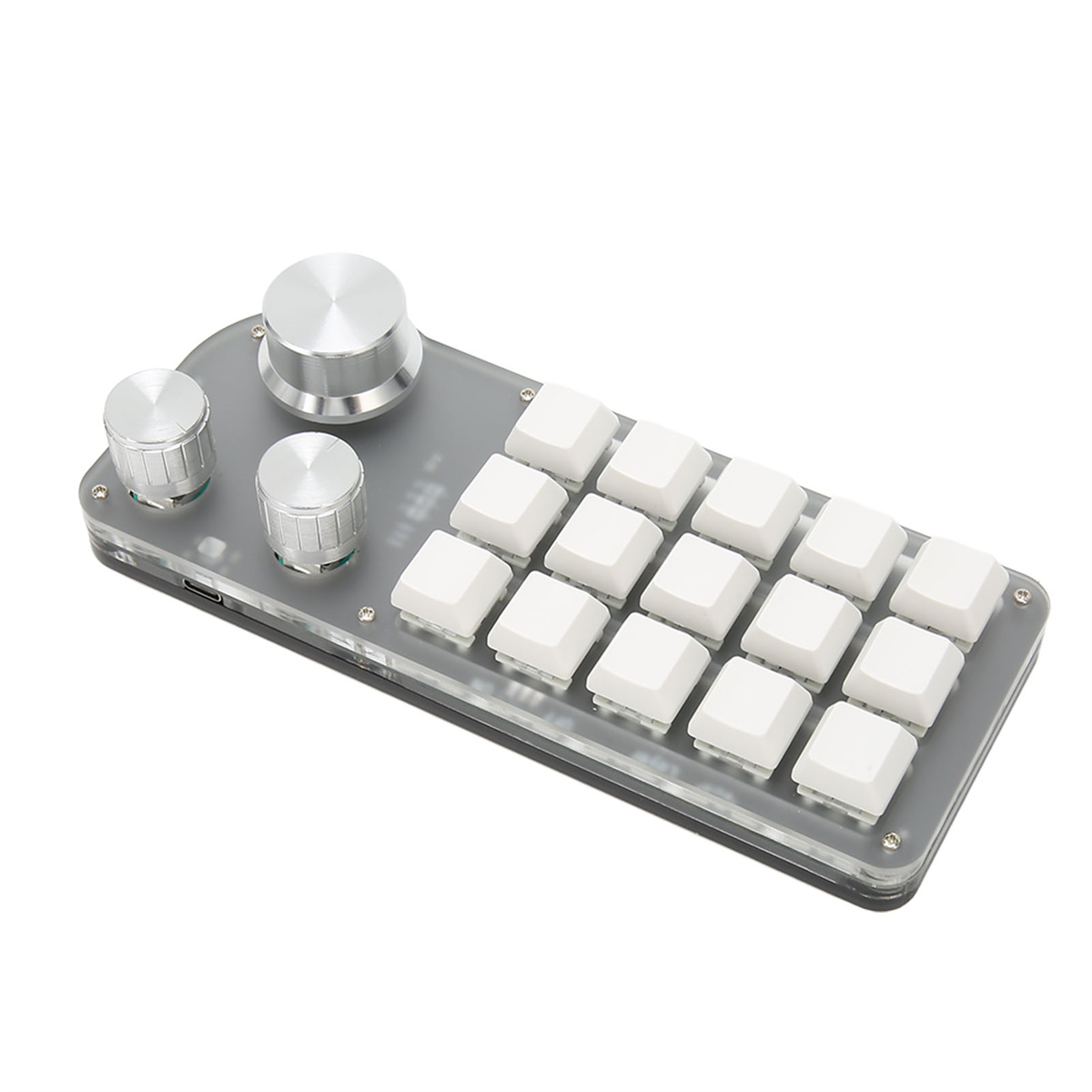 Eine kleine schwarze Tastatur mit grauen Knöpfen und weißen quadratischen Tasten.