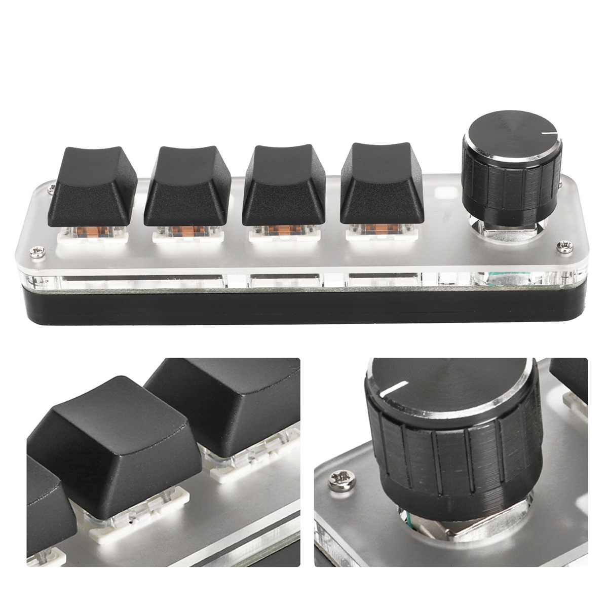 Bedienfeld mit vier schwarzen Tasten und einem Knopf auf hellfarbiger Oberfläche.