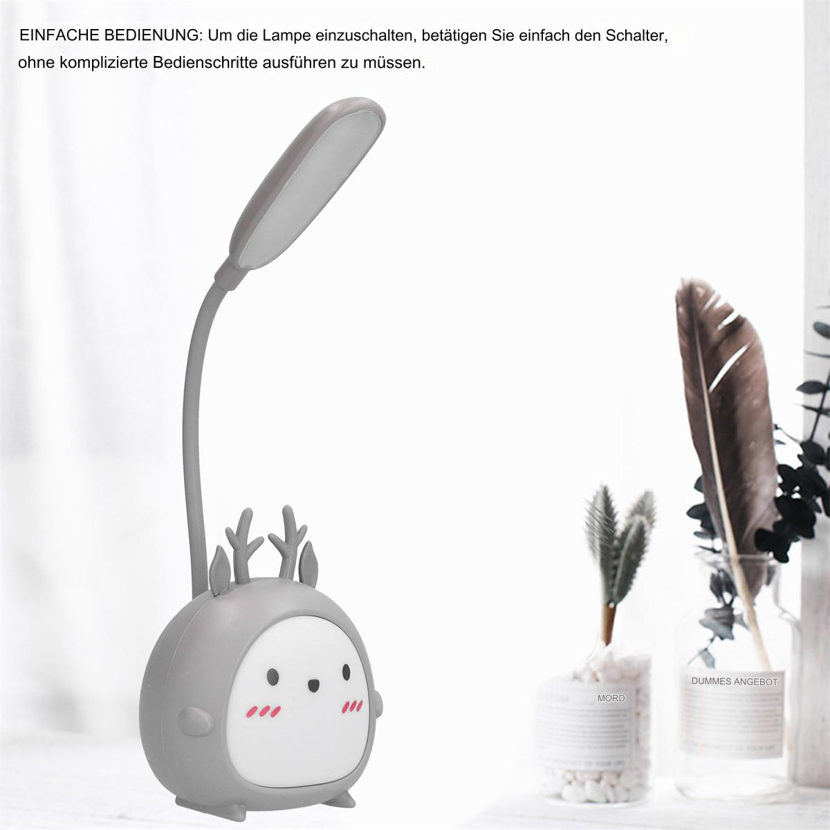Eine cartoonartige Lampe mit Hirschkopf-Design und eine kleine Pflanze in einer Vase.