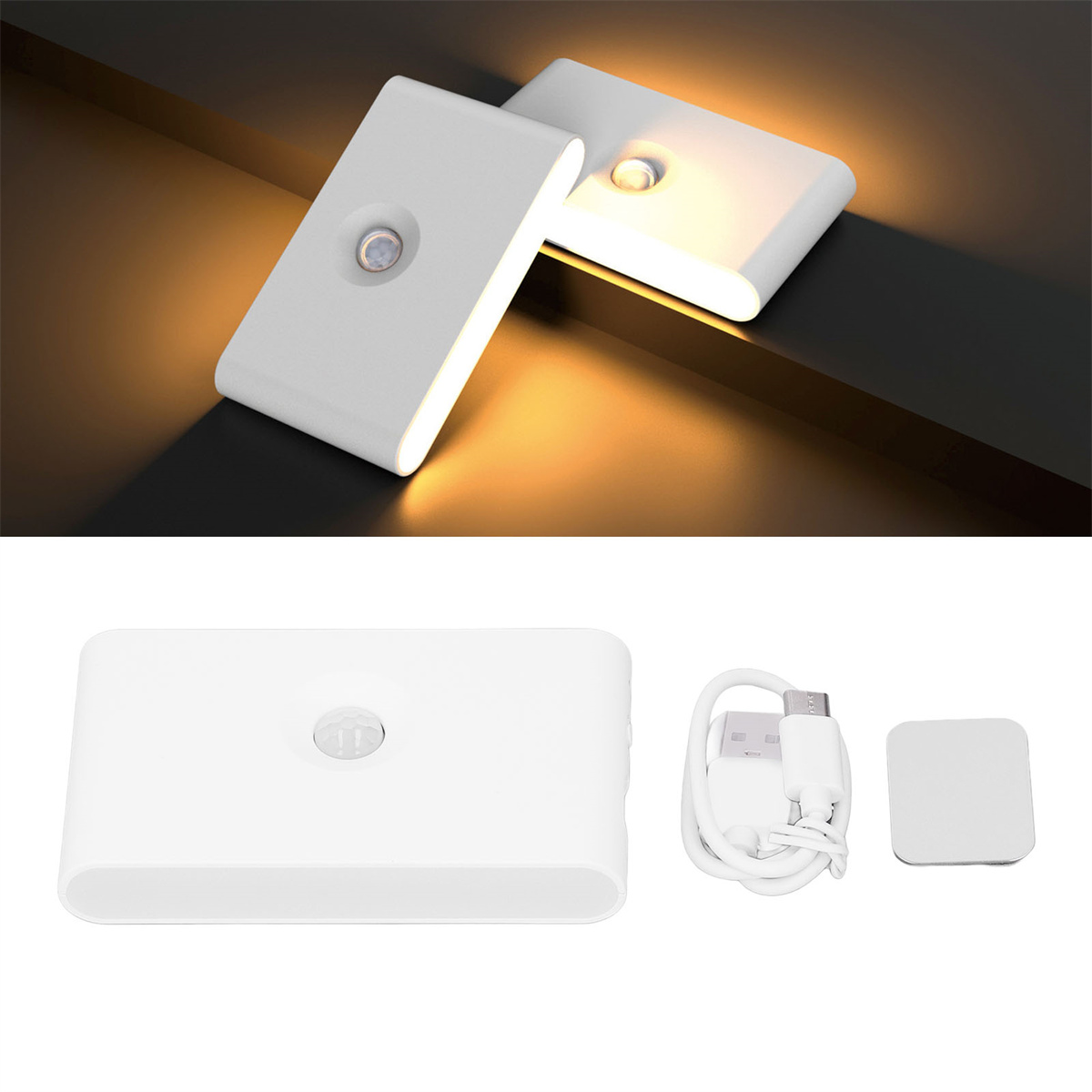 Zwei weiße Nachtlichter. Eines ist beleuchtet. Ein Ladekabel und ein Aufkleber sind ebenfalls sichtbar.