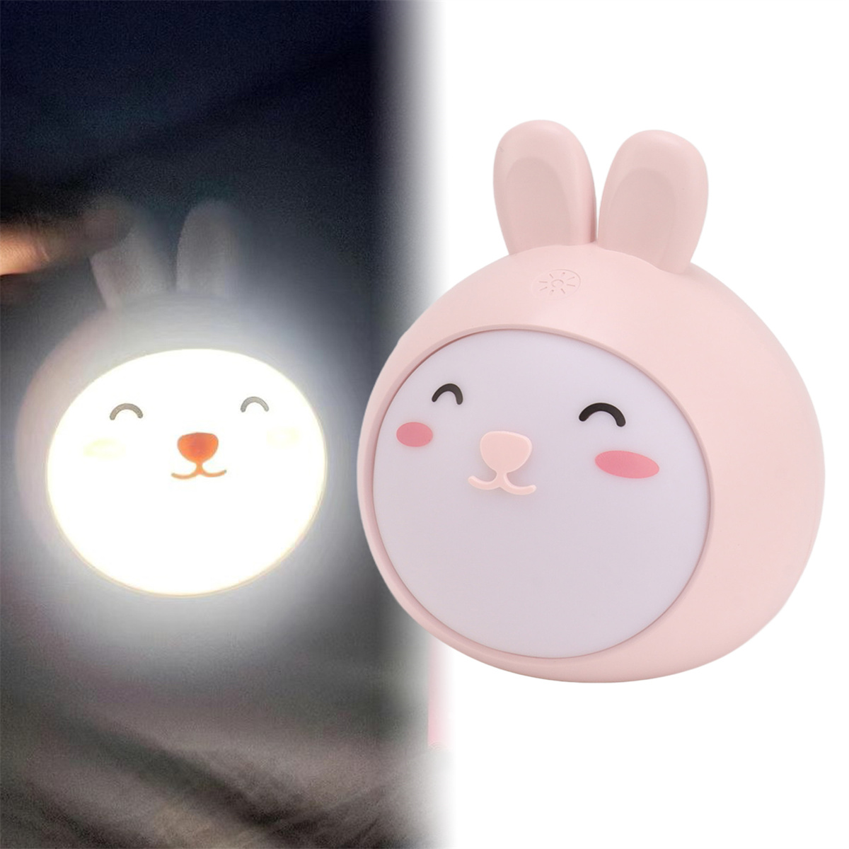 Ein rosa nachtlichtförmiger Hase. Die Lampe hat ein leuchtendes Gesicht, darunter ein USB-Kabel.