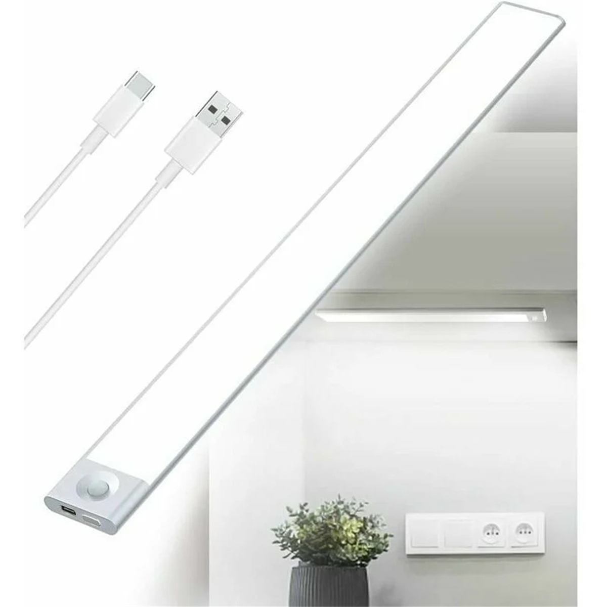 Ein langes, weißes LED-Streifenlicht mit zwei USB-Kabeln und einer Pflanze im Hintergrund.
