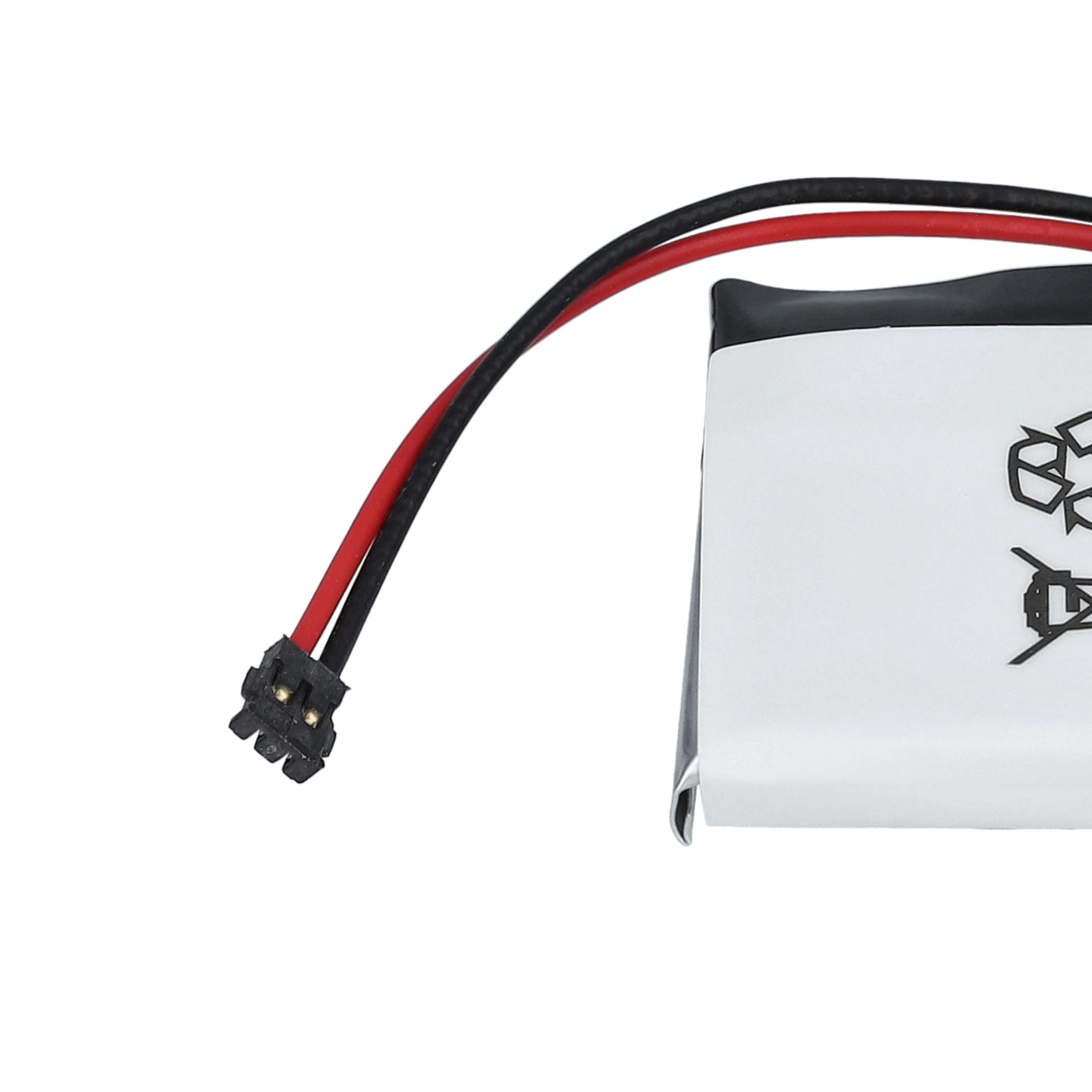 Eine Batterie mit roten und schwarzen Drähten, die mit einem kleinen Stecker verbunden sind.