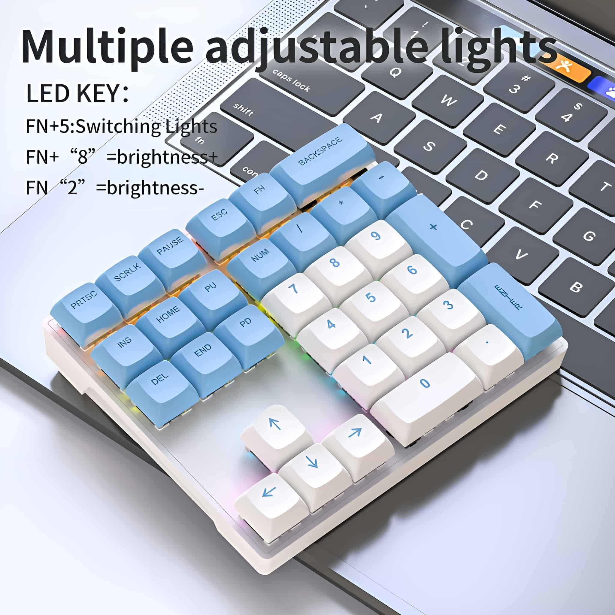Tastatur mit mehreren einstellbaren Lichtern. Weiße und blaue Tasten auf einem Laptop.
