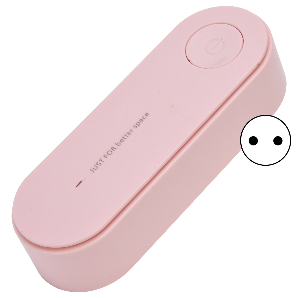Ein rosa Gerät mit den Worten 'JUST FOR better space' und einem Stromsteckersymbol an der Seite.
