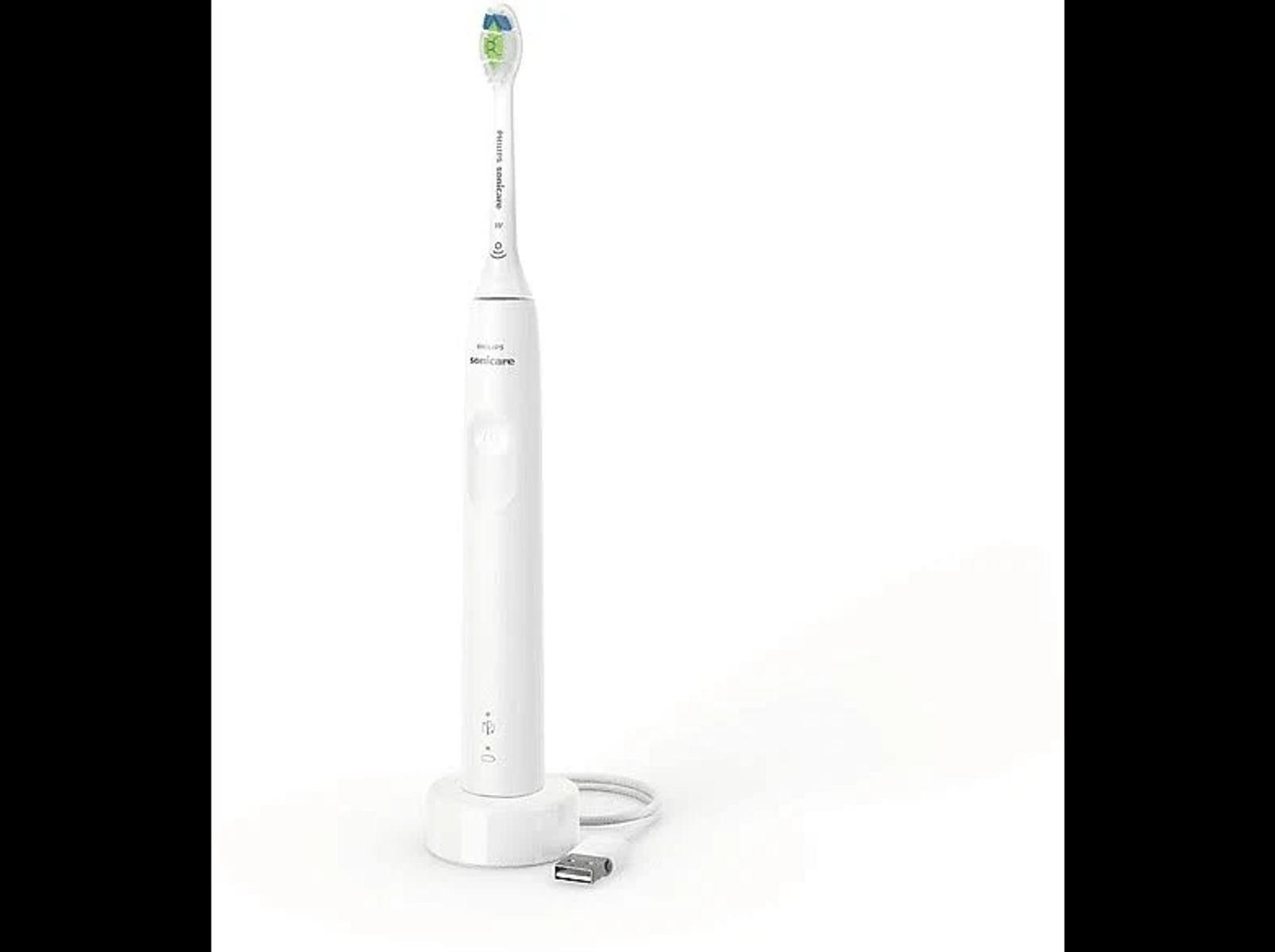 Biała elektryczna szczoteczka do zębów na stacji ładującej. Do podstawy podłączony jest przewód.