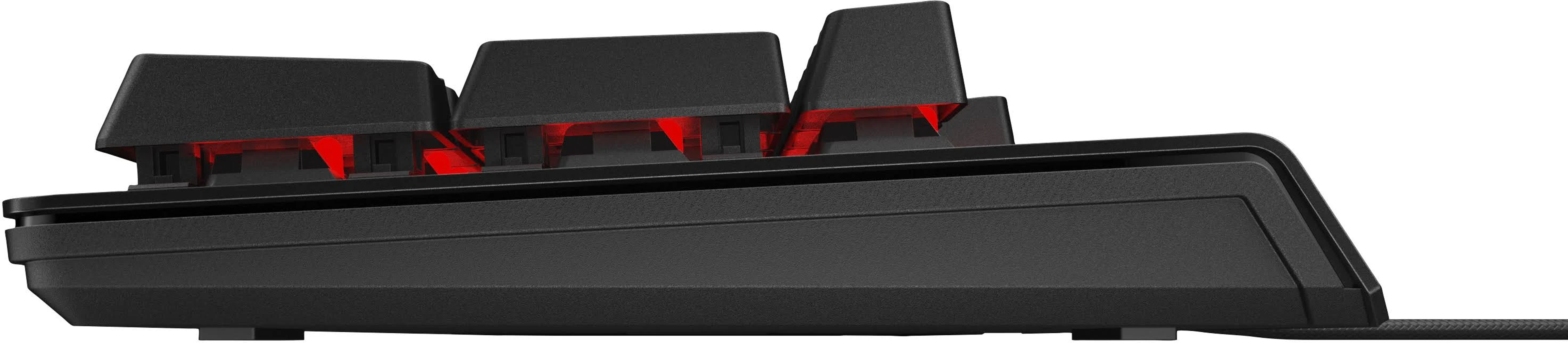 Teclado mecánico negro, vista lateral, con luces rojas visibles en el interior. Las teclas son negras.