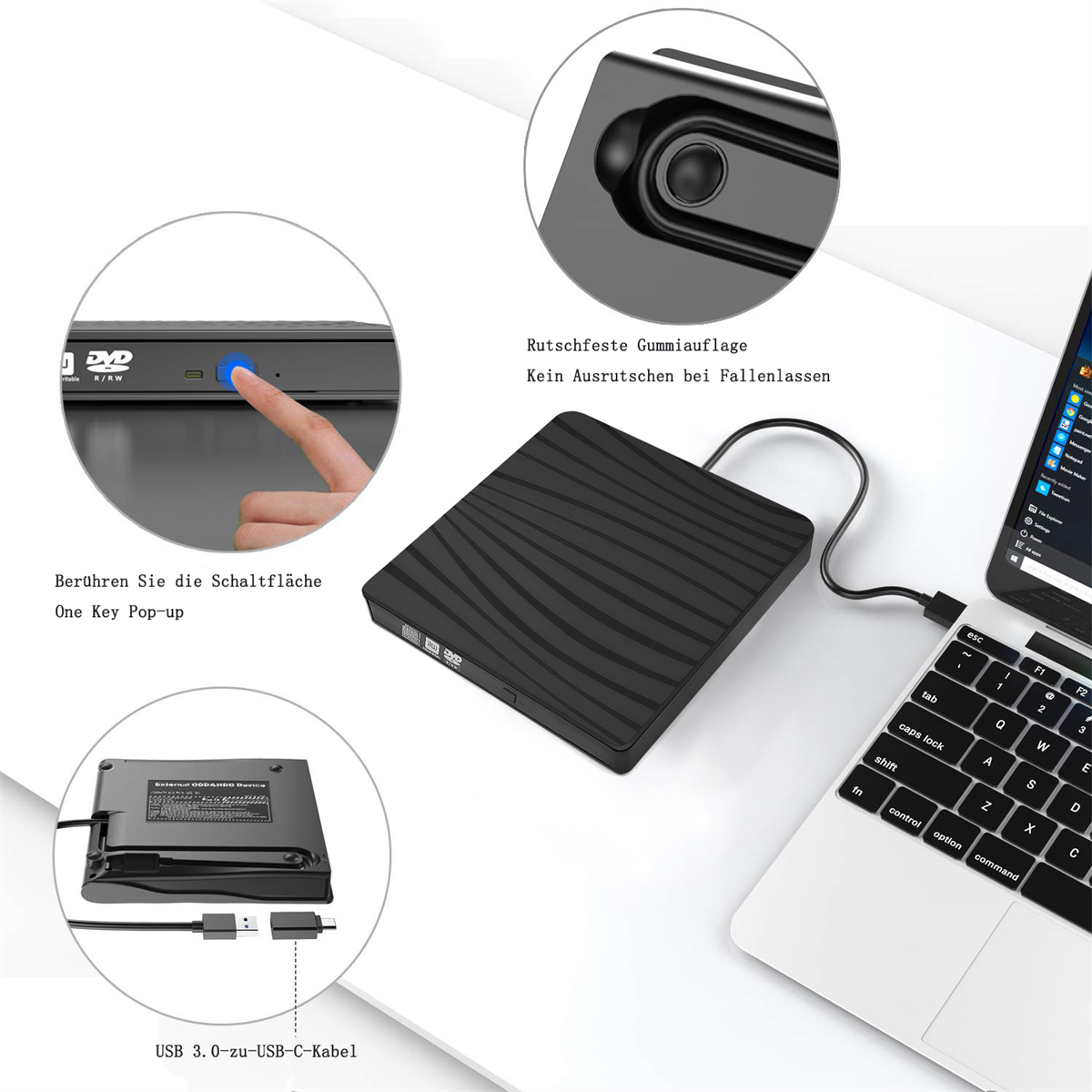 Ein schwarzer DVD-Player neben einem Laptop. Ein Finger drückt eine Taste auf dem Player.
