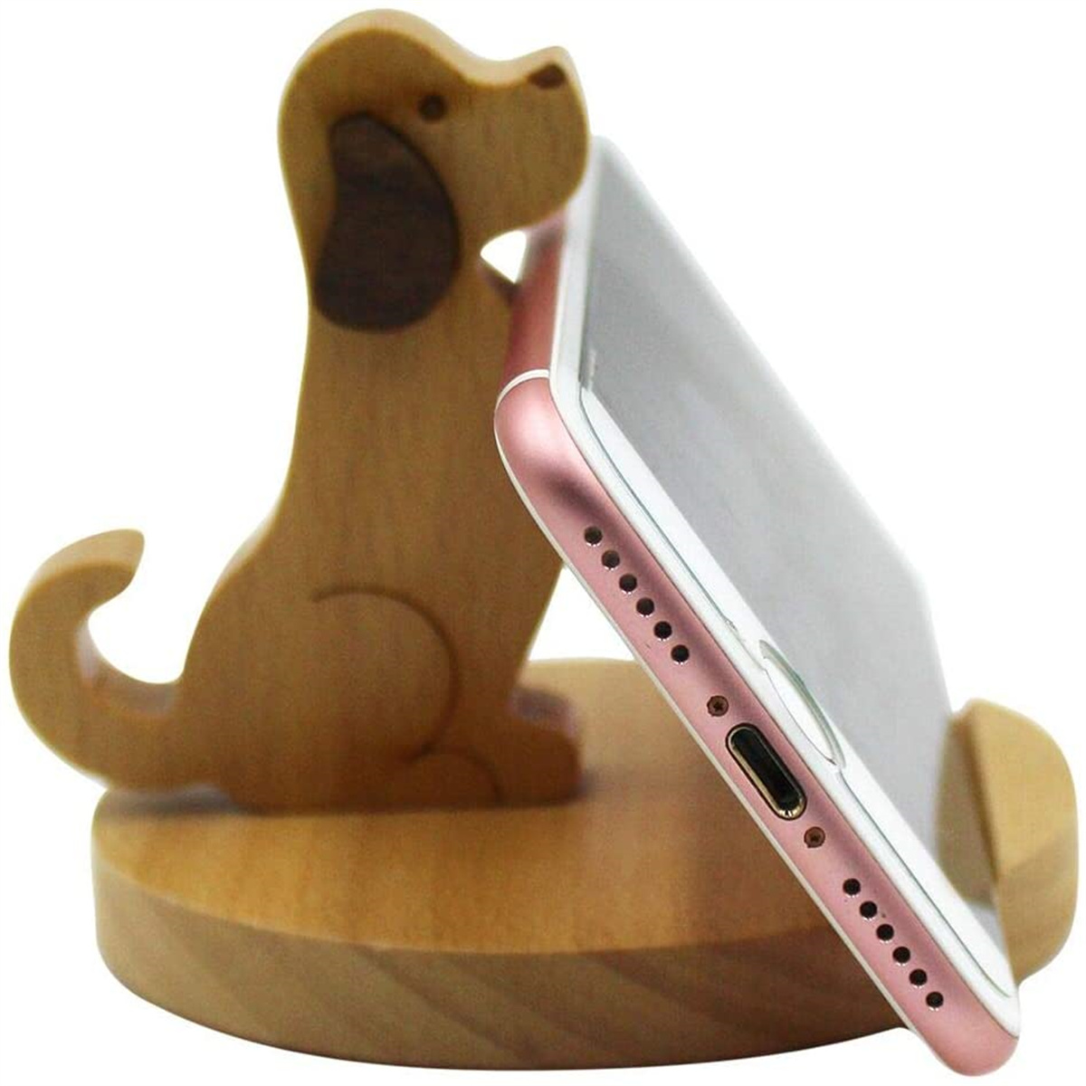 Hölzerner Hundeförmiger Telefonständer, der ein rosa Telefon hält.
