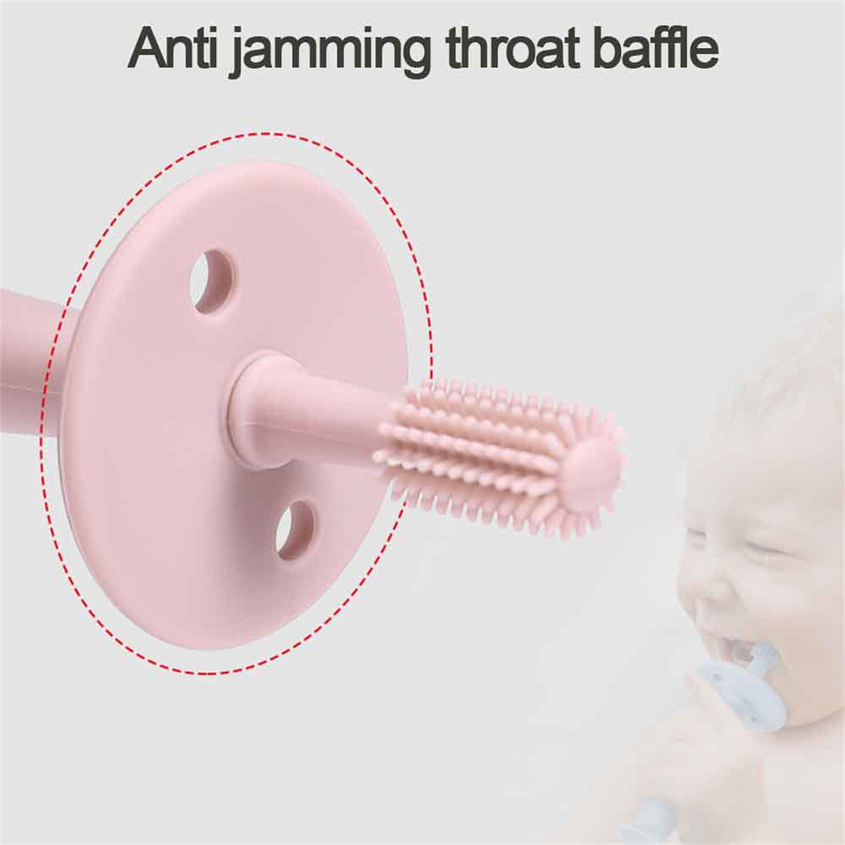 Rosa Baby-Zahnbürste mit Anti-Blockier-Design. Ein Baby ist im Hintergrund zu sehen.