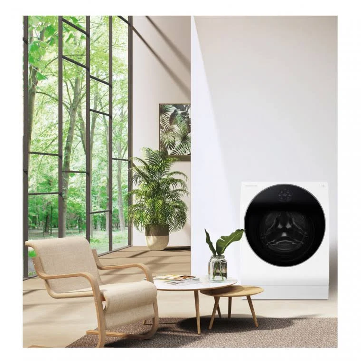 Interior moderno con lavadora, planta, mesa y vista de árboles desde la ventana.