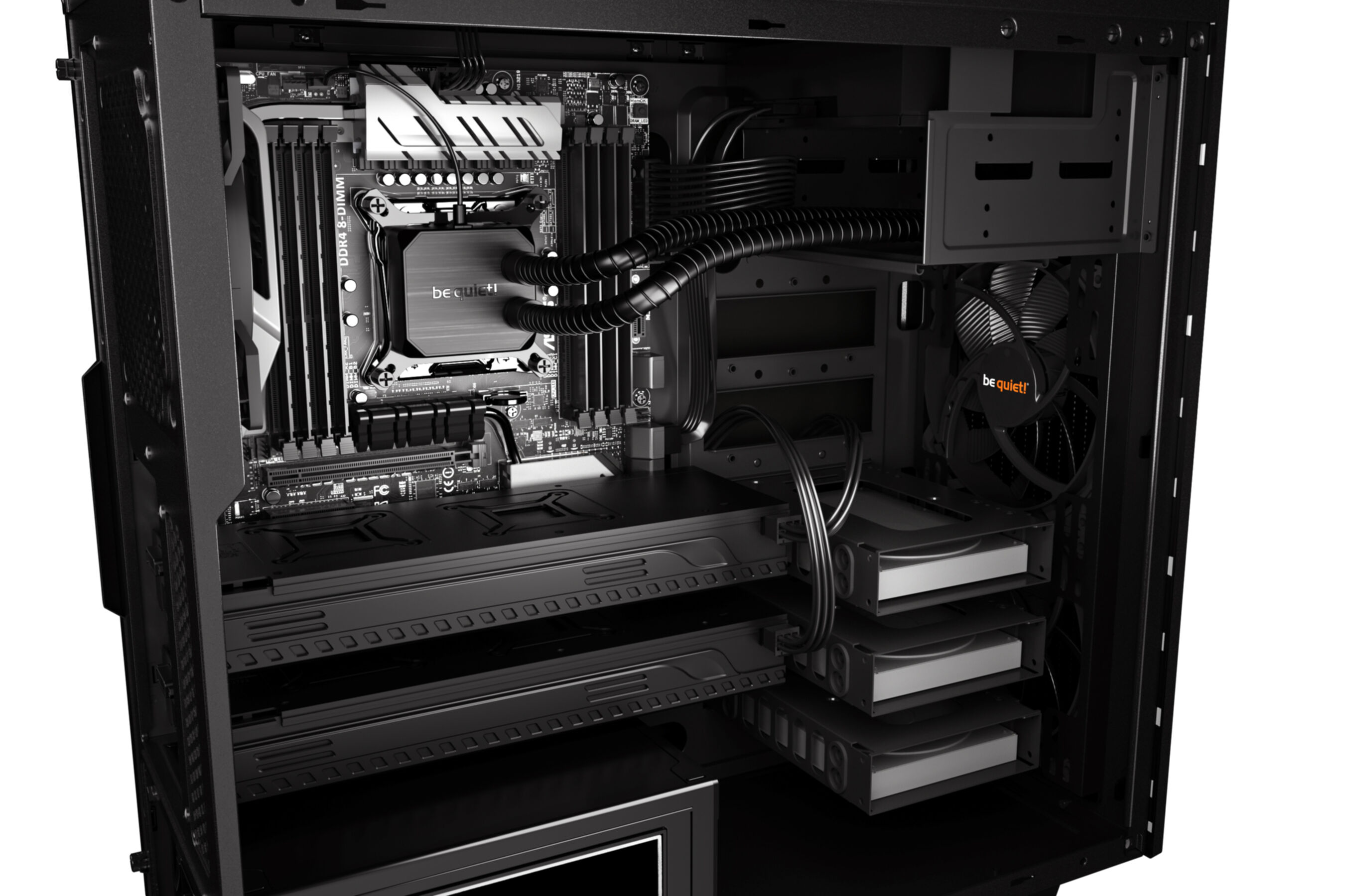 À l'intérieur d'un boîtier d'ordinateur noir avec des composants : carte mère, refroidisseur de CPU, GPU, disques durs et câbles.
