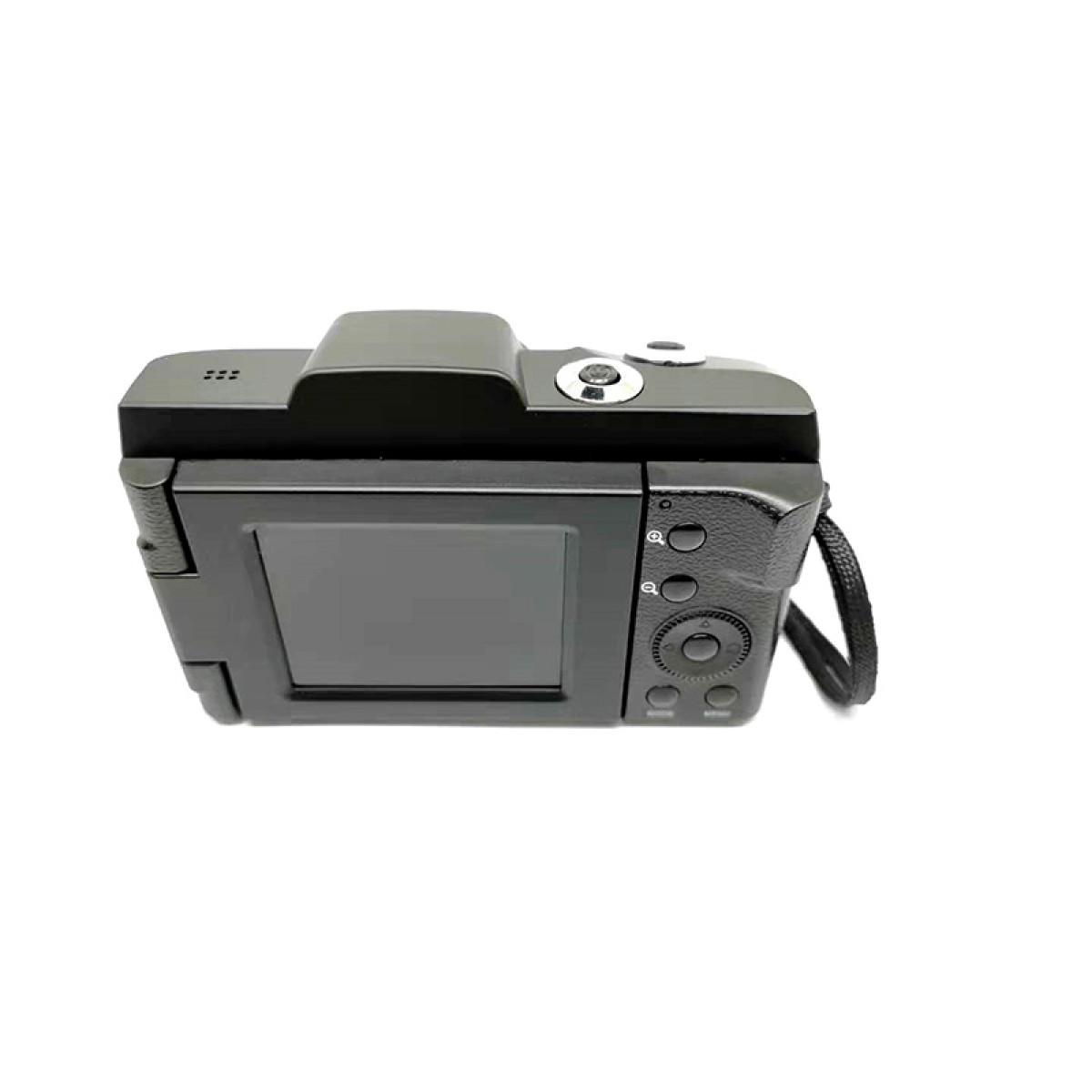 Czarny aparat, widok z góry, z ekranem i przyciskami. Aparat leży na białej powierzchni.