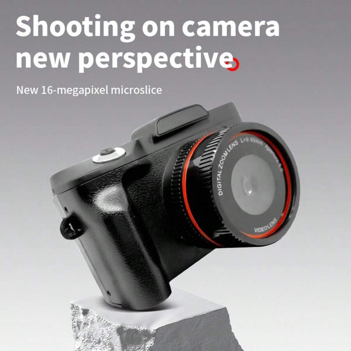 Czarny aparat na białej skale. Tekst: Robienie zdjęć z nowej perspektywy.