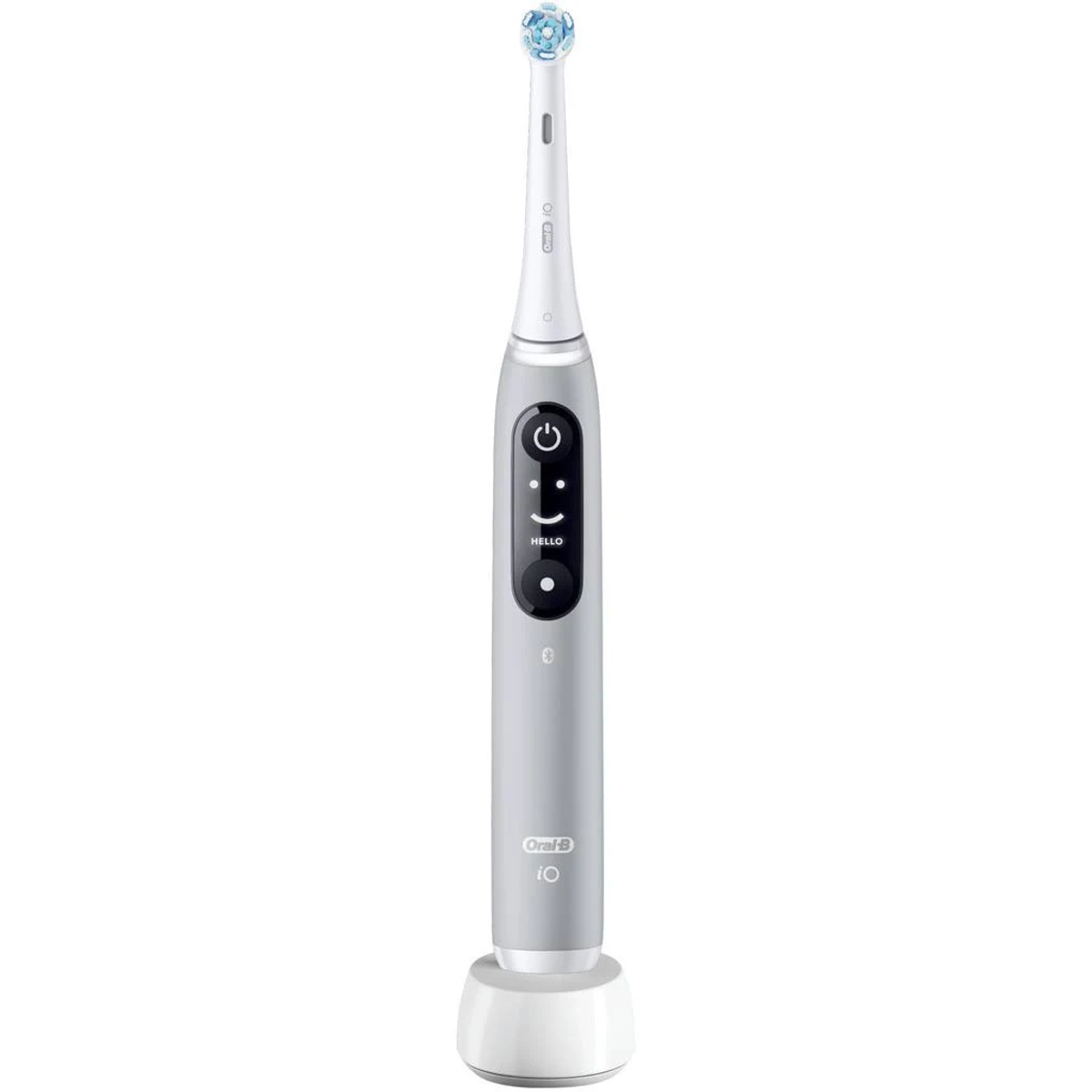 Uno spazzolino elettrico Oral-B grigio su un supporto bianco. Lo spazzolino ha pulsanti e un display a faccina.
