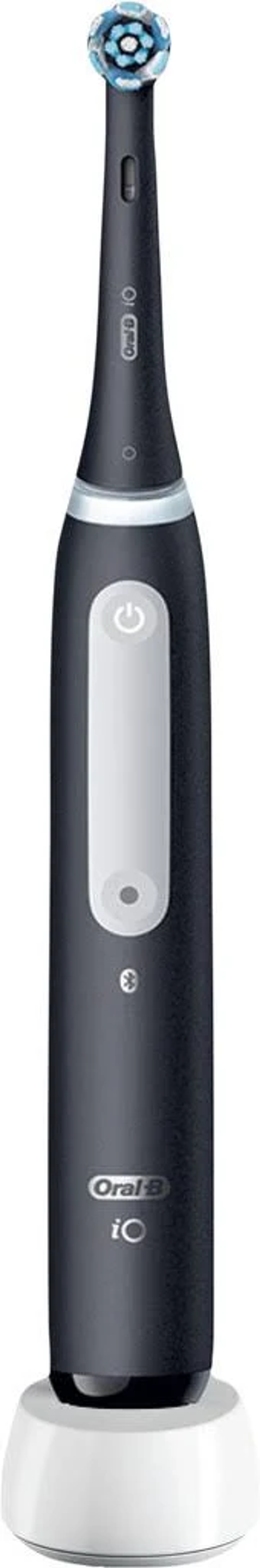 Czarno-biała elektryczna szczoteczka do zębów na białej stacji ładującej. Ma czarny korpus i biały przycisk zasilania.