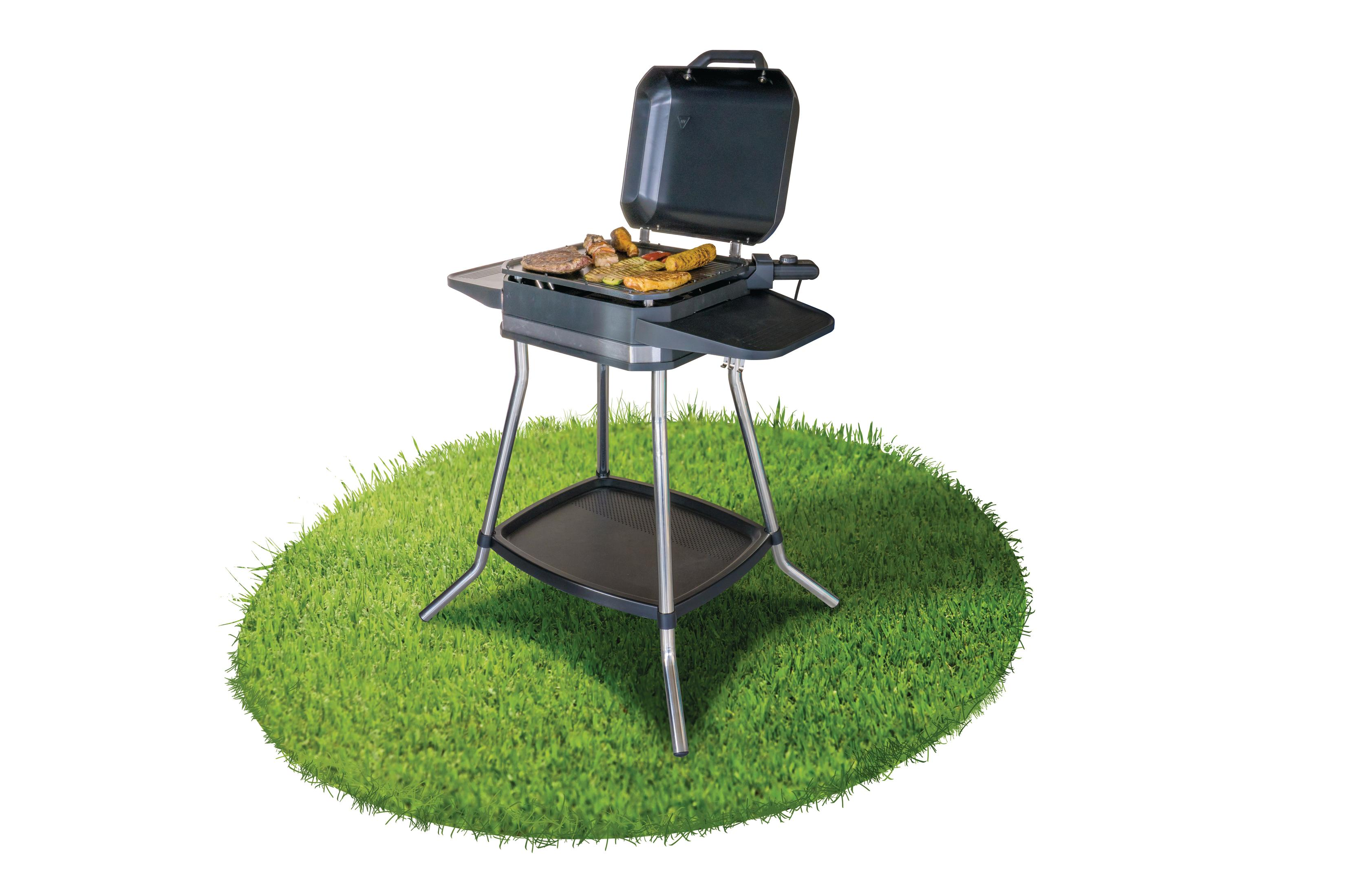 Ein elektrischer Außengrill mit Essen darauf, auf einer ovalen grasartigen Oberfläche.